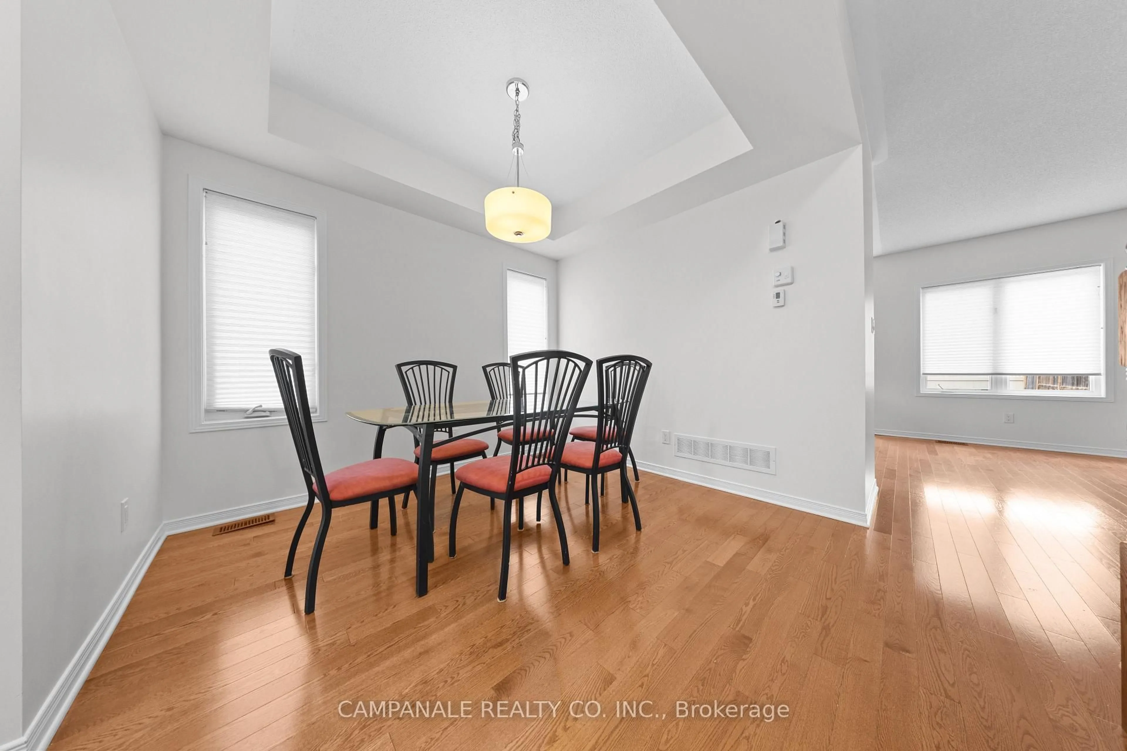 Dining room, wood/laminate floor for 607 Via Amalfi St, Ottawa Ontario K2J 5X8