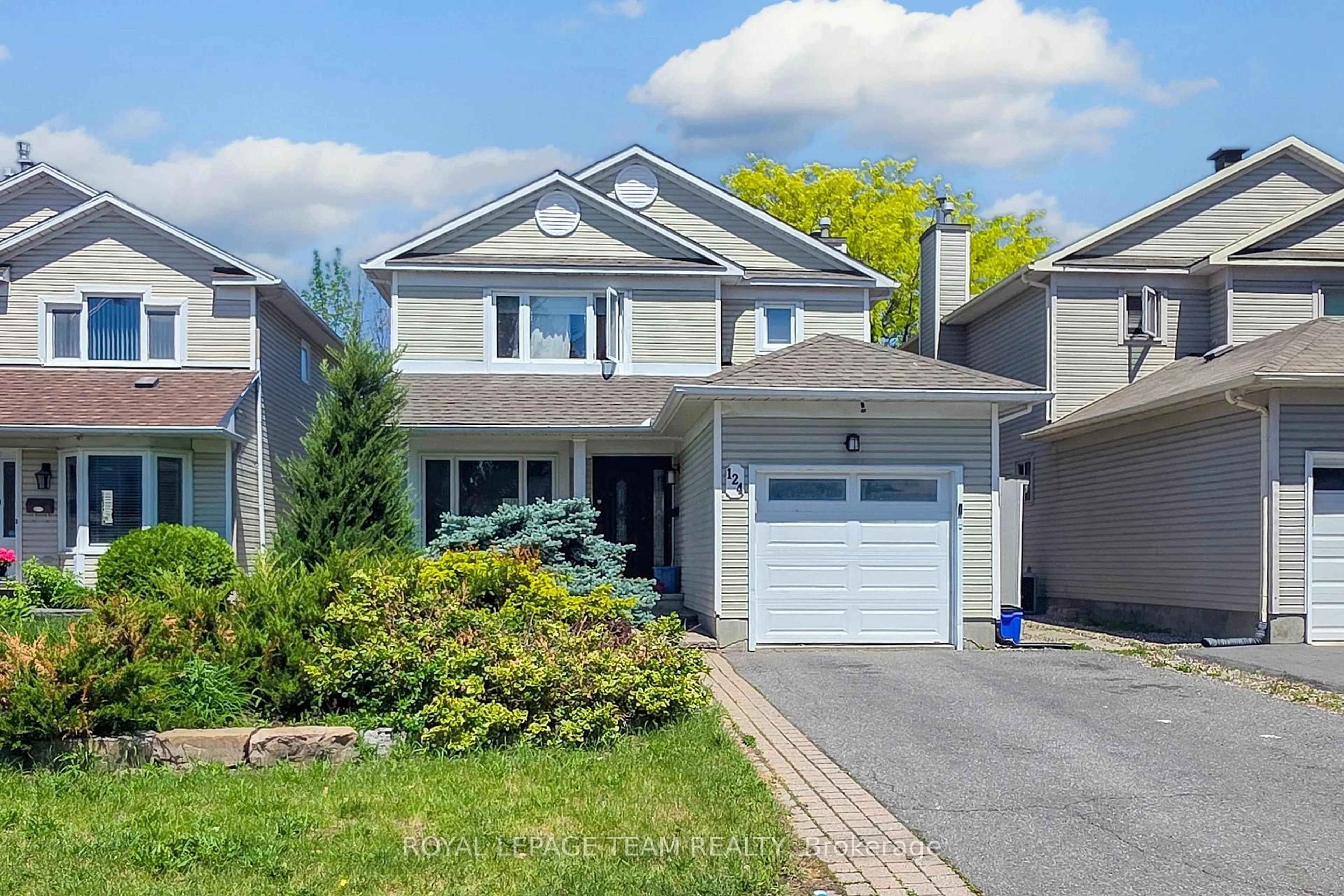 Home with vinyl exterior material, street for 124 Kennevale Dr, Ottawa Ontario K2J 3X7