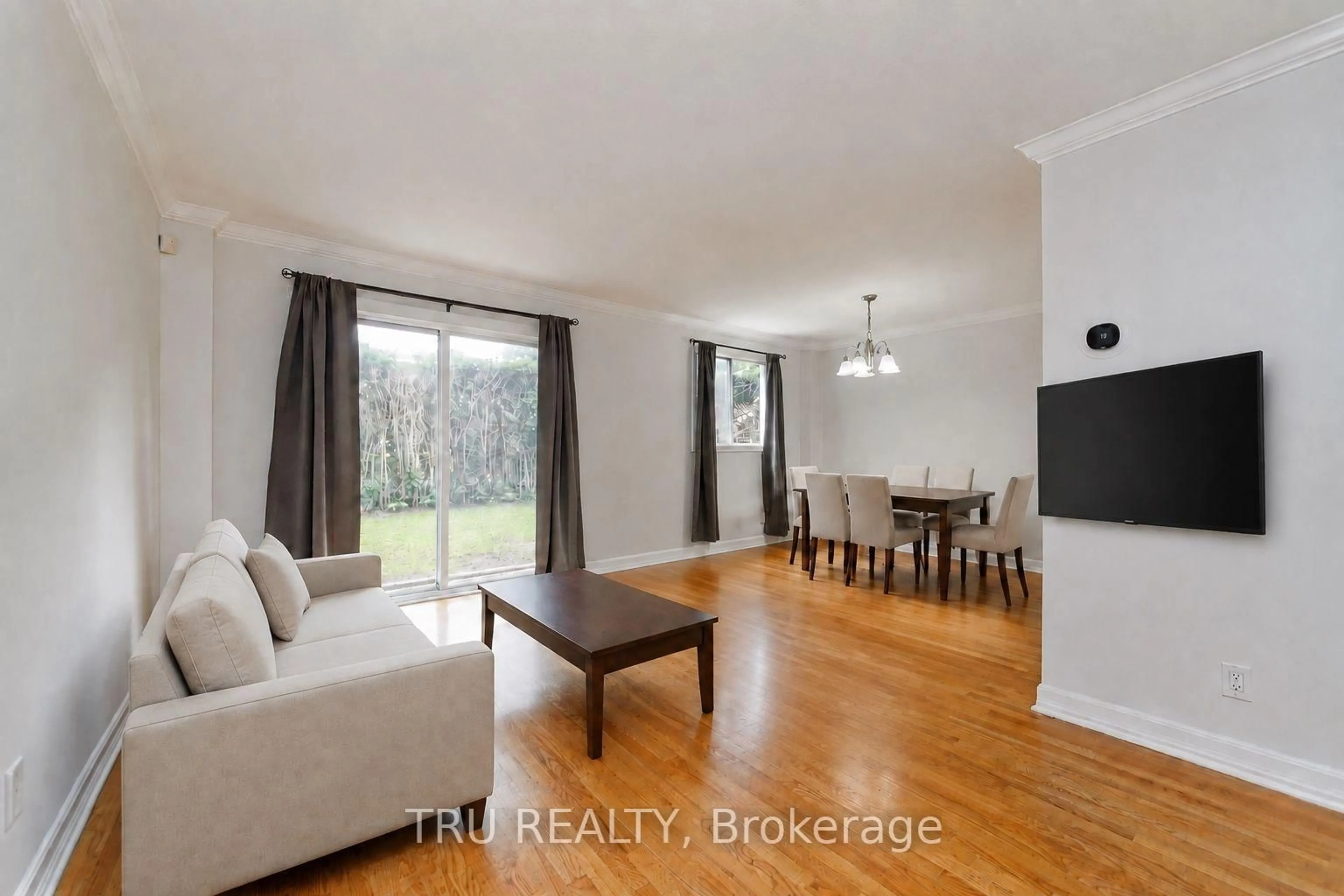 Living room with furniture, wood/laminate floor for 14 Wolfgang Dr, Nepean Ontario K2J 1T1