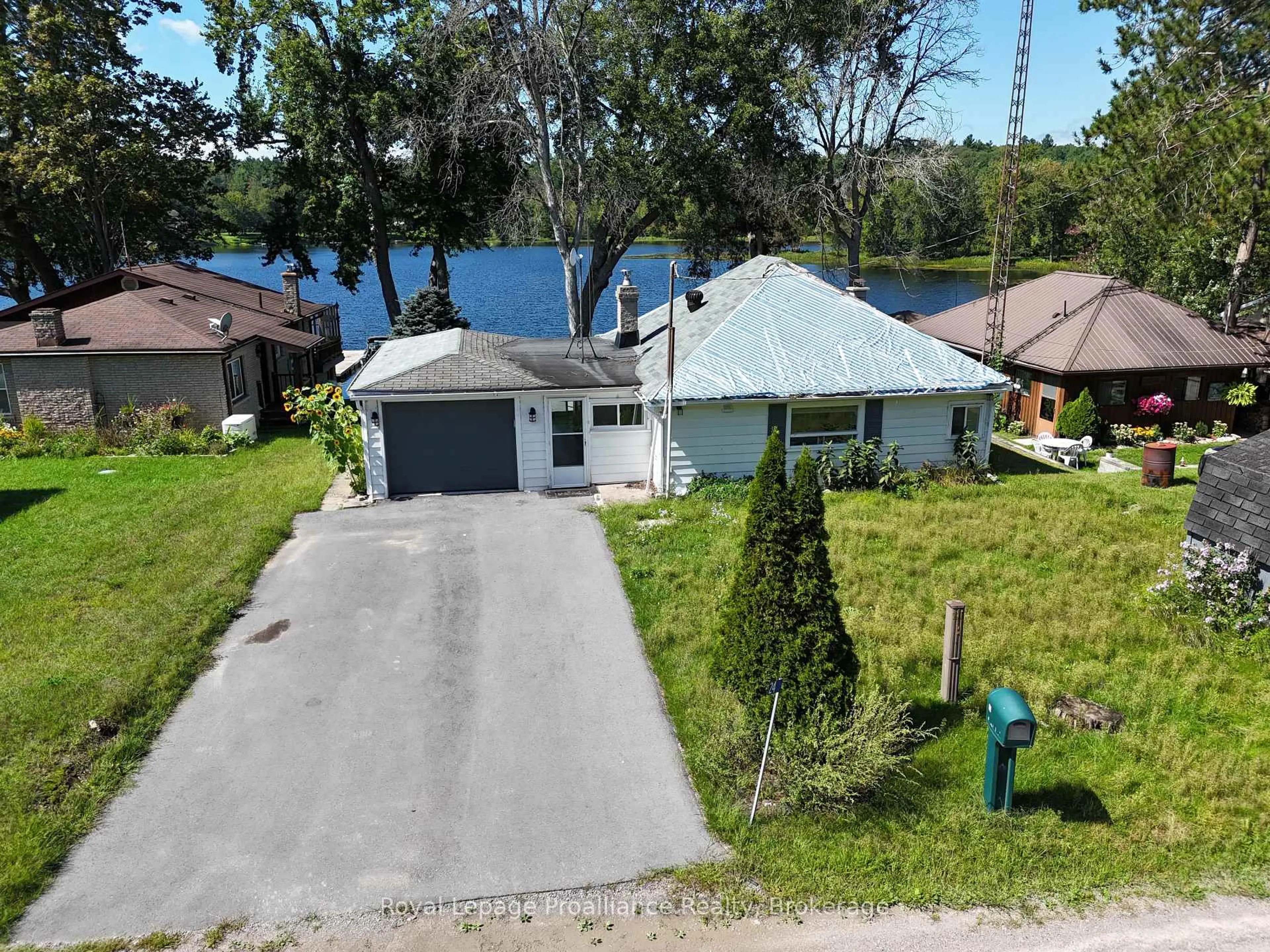 A pic from outside/outdoor area/front of a property/back of a property/a pic from drone, water/lake/river/ocean view for 24 Cosy Cove Lane, Tweed Ontario K0K 3J0