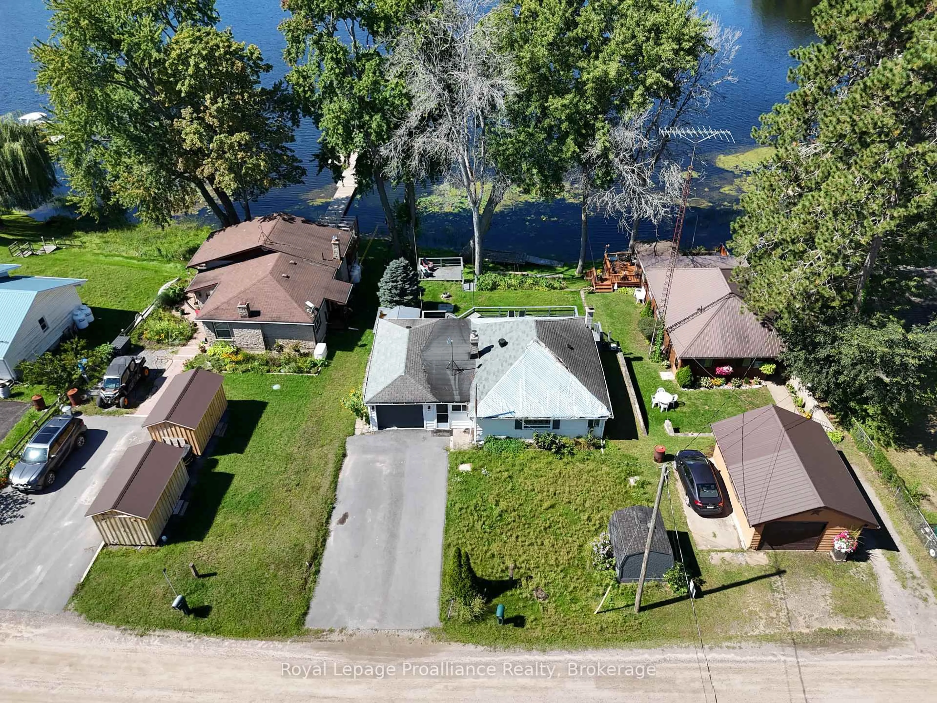 A pic from outside/outdoor area/front of a property/back of a property/a pic from drone, water/lake/river/ocean view for 24 Cosy Cove Lane, Tweed Ontario K0K 3J0