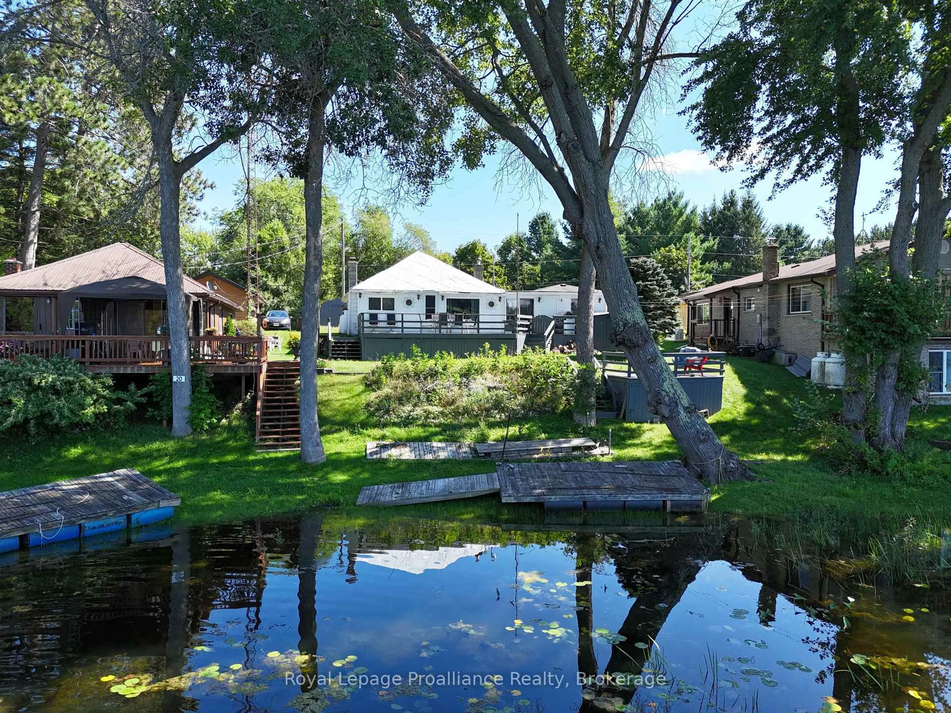 A pic from outside/outdoor area/front of a property/back of a property/a pic from drone, water/lake/river/ocean view for 24 Cosy Cove Lane, Tweed Ontario K0K 3J0