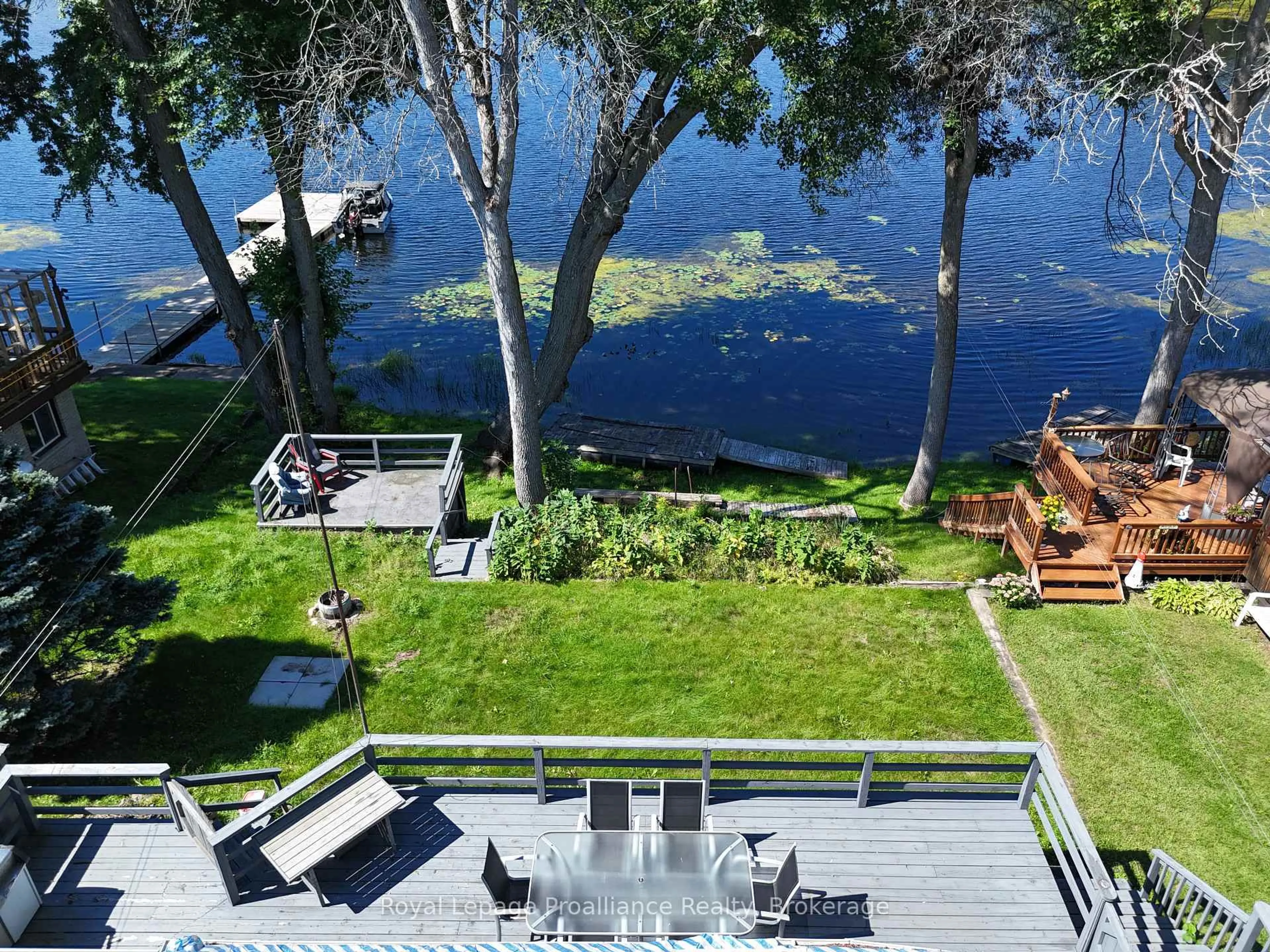 A pic from outside/outdoor area/front of a property/back of a property/a pic from drone, water/lake/river/ocean view for 24 Cosy Cove Lane, Tweed Ontario K0K 3J0