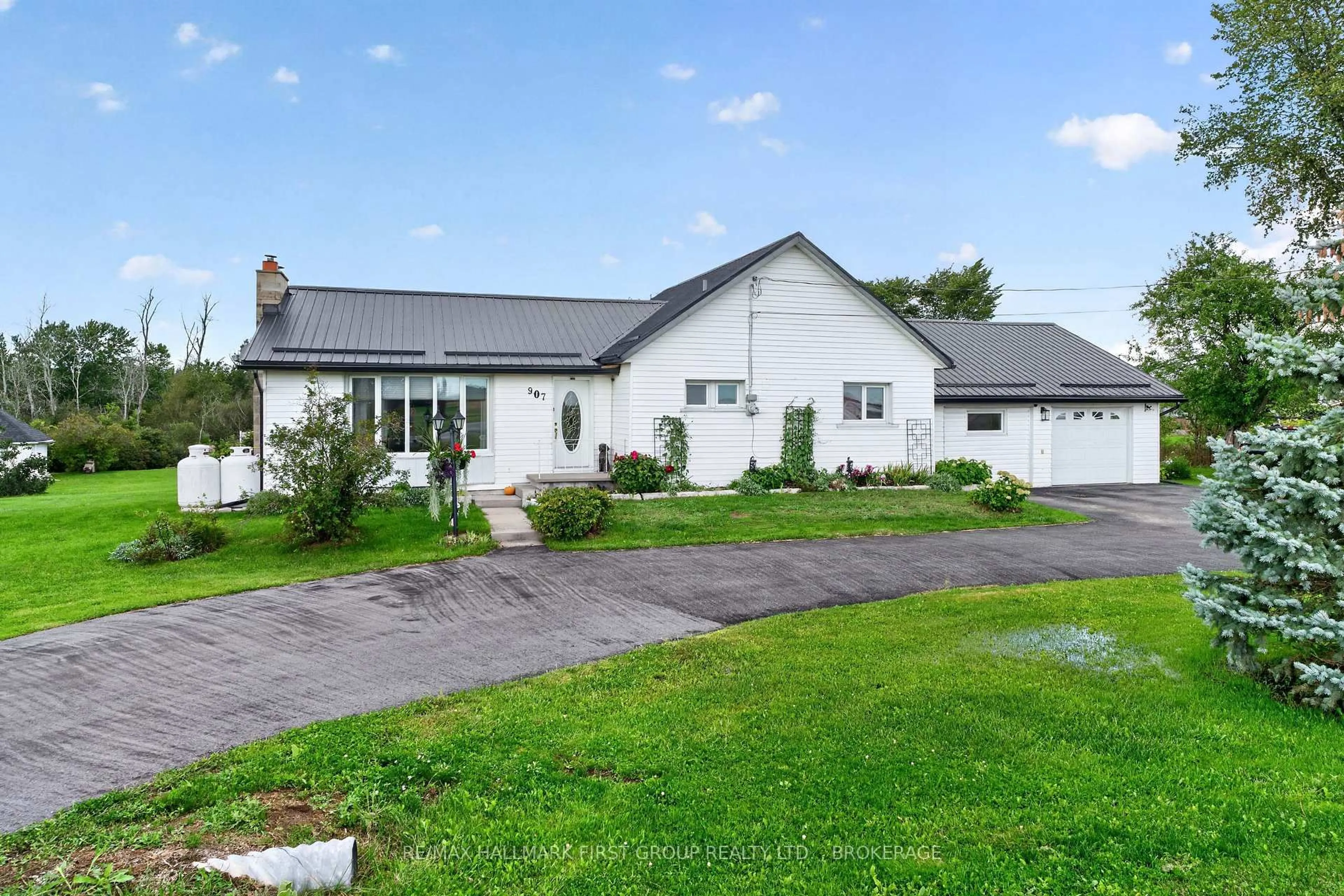 A pic from outside/outdoor area/front of a property/back of a property/a pic from drone, unknown for 907 Millhaven Rd, Bissett Creek Ontario K0H 2H0