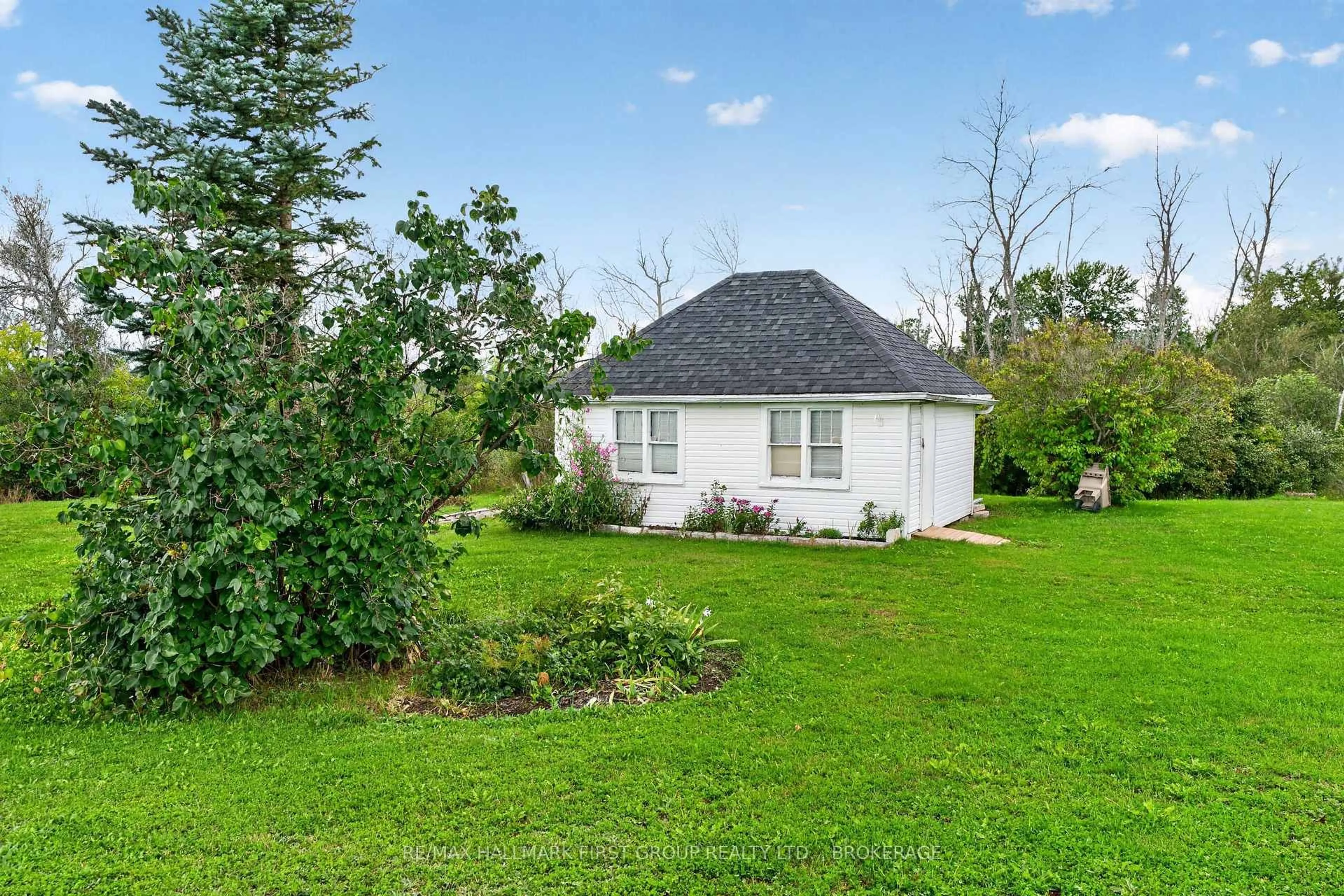 A pic from outside/outdoor area/front of a property/back of a property/a pic from drone, water/lake/river/ocean view for 907 Millhaven Rd, Bissett Creek Ontario K0H 2H0