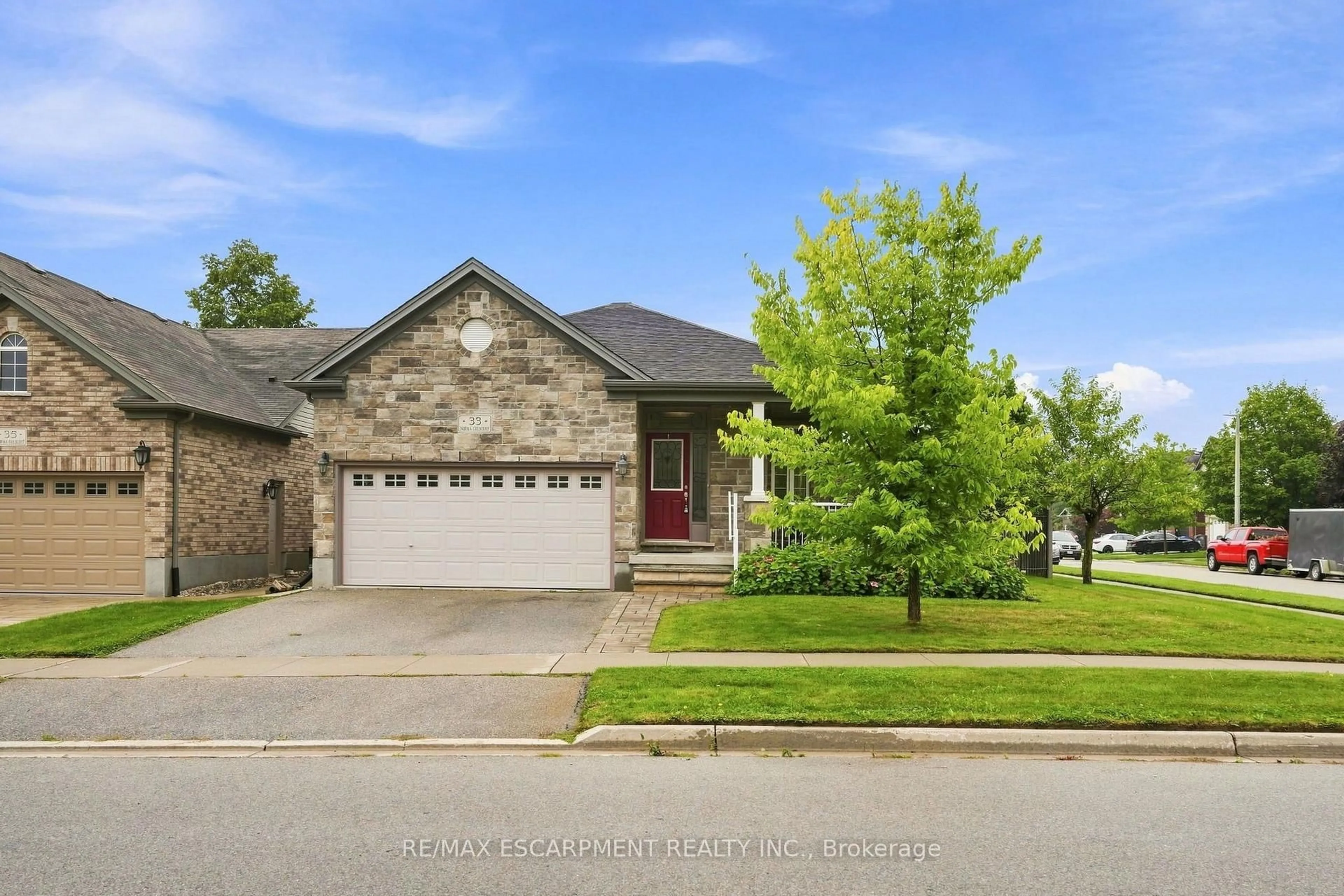 Home with brick exterior material, street for 33 Norma Cres, Guelph Ontario N1E 7M4