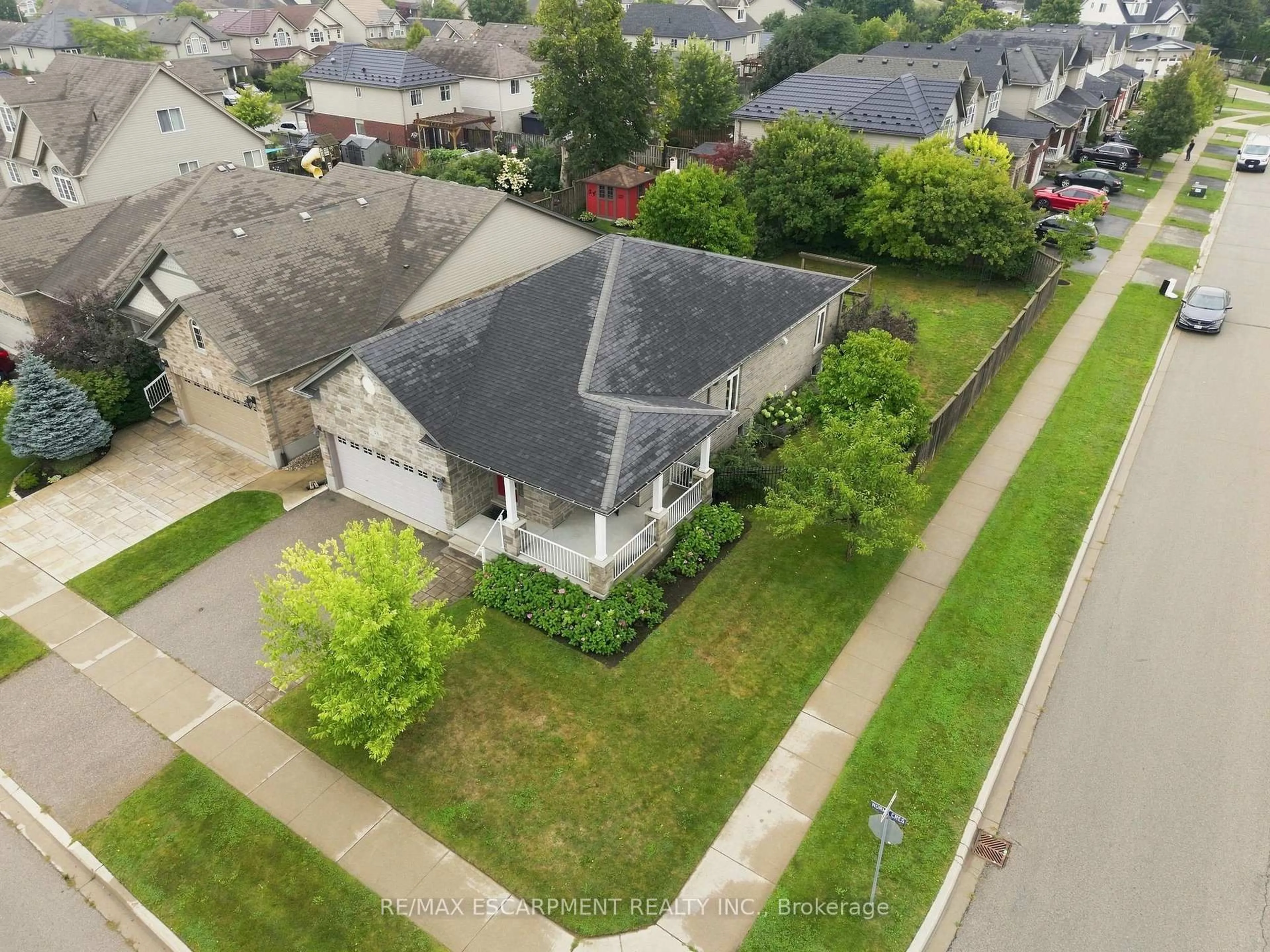 A pic from outside/outdoor area/front of a property/back of a property/a pic from drone, street for 33 Norma Cres, Guelph Ontario N1E 7M4