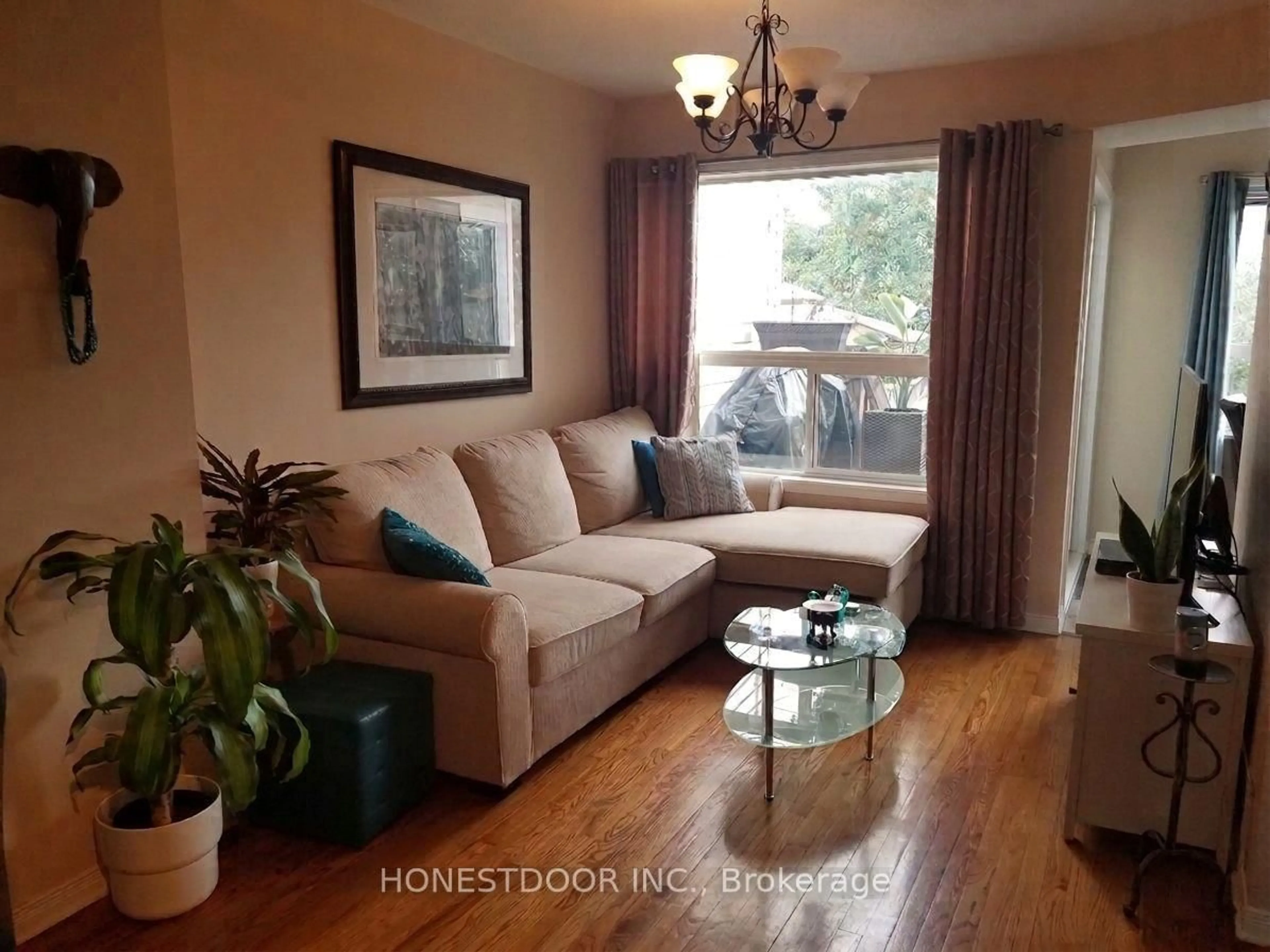 Living room with furniture, wood/laminate floor for 49 Mullcraft Cres, Ottawa Ontario K2J 4P7