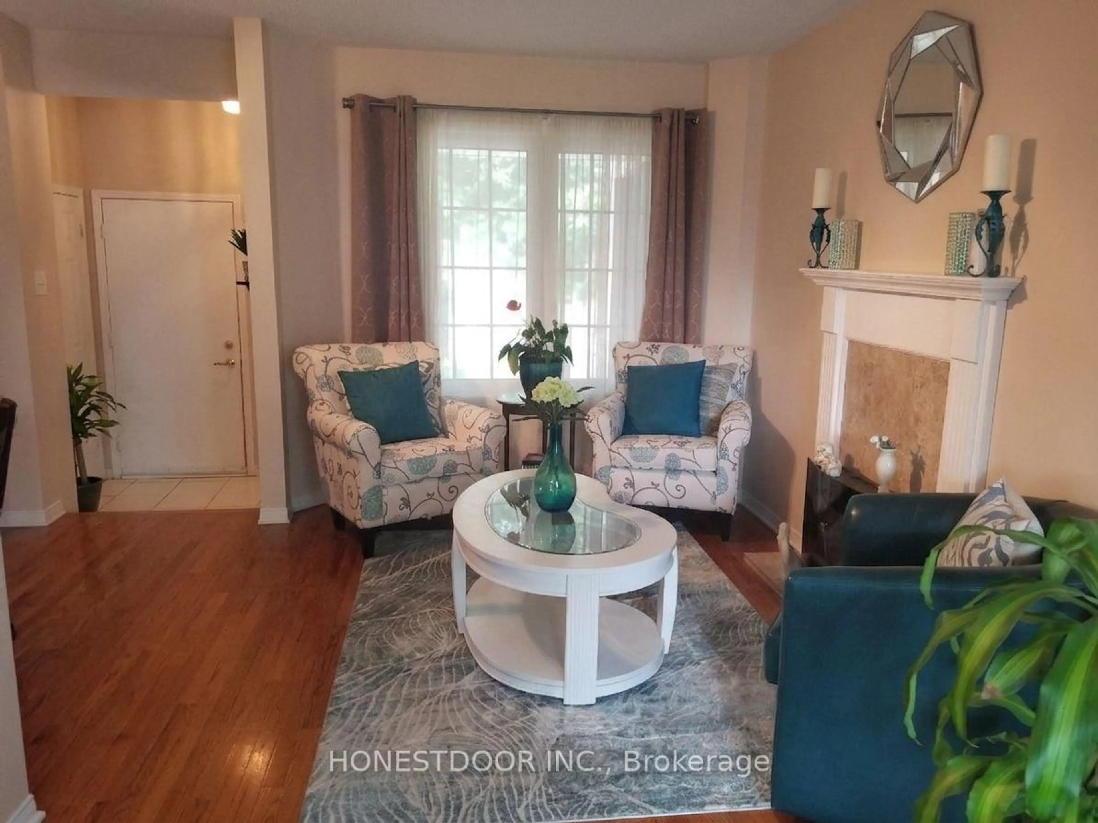 Living room with furniture, wood/laminate floor for 49 Mullcraft Cres, Ottawa Ontario K2J 4P7
