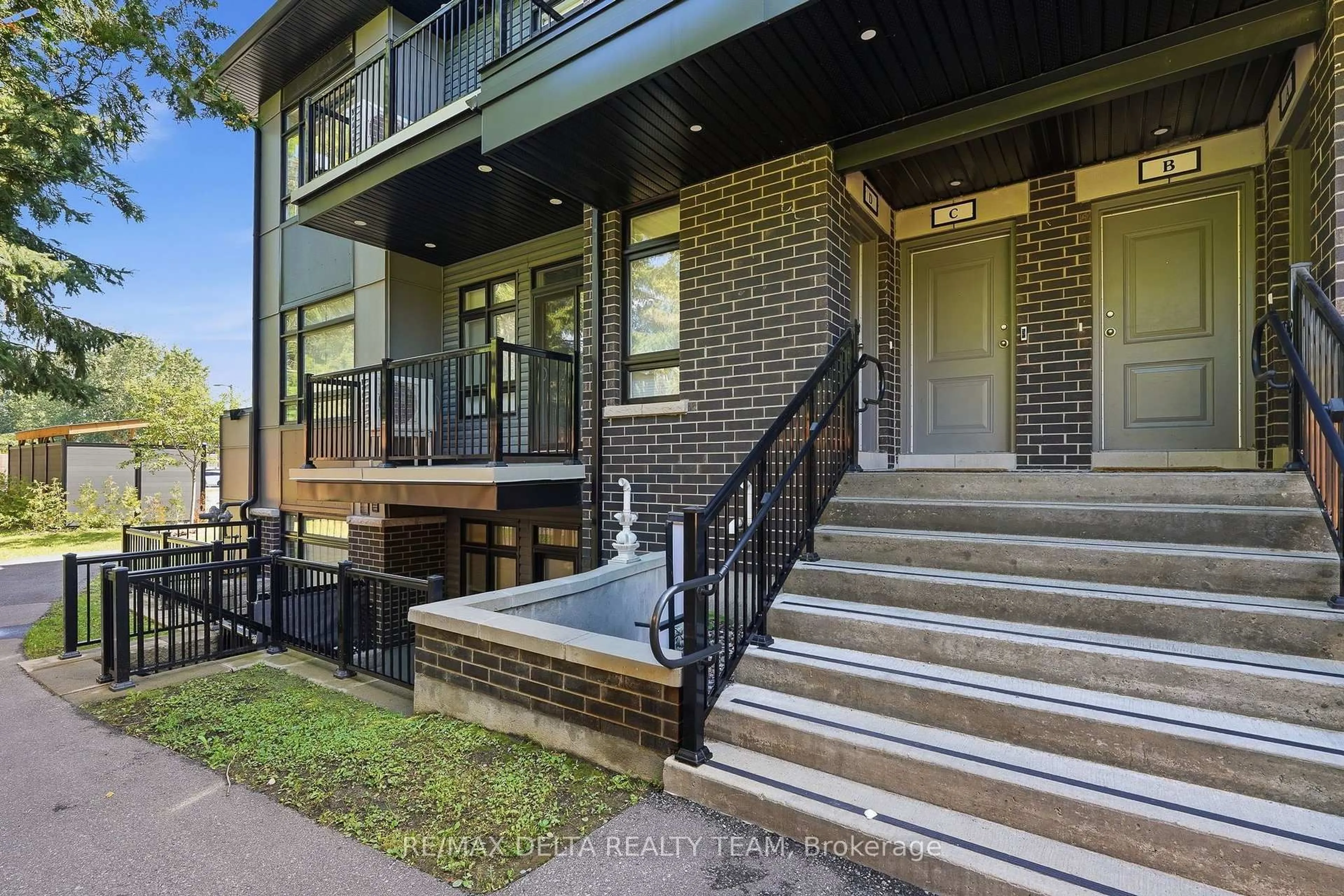 Home with brick exterior material, street for 400 C Rolling Meadow Cres #C, Ottawa Ontario K1W 0S1