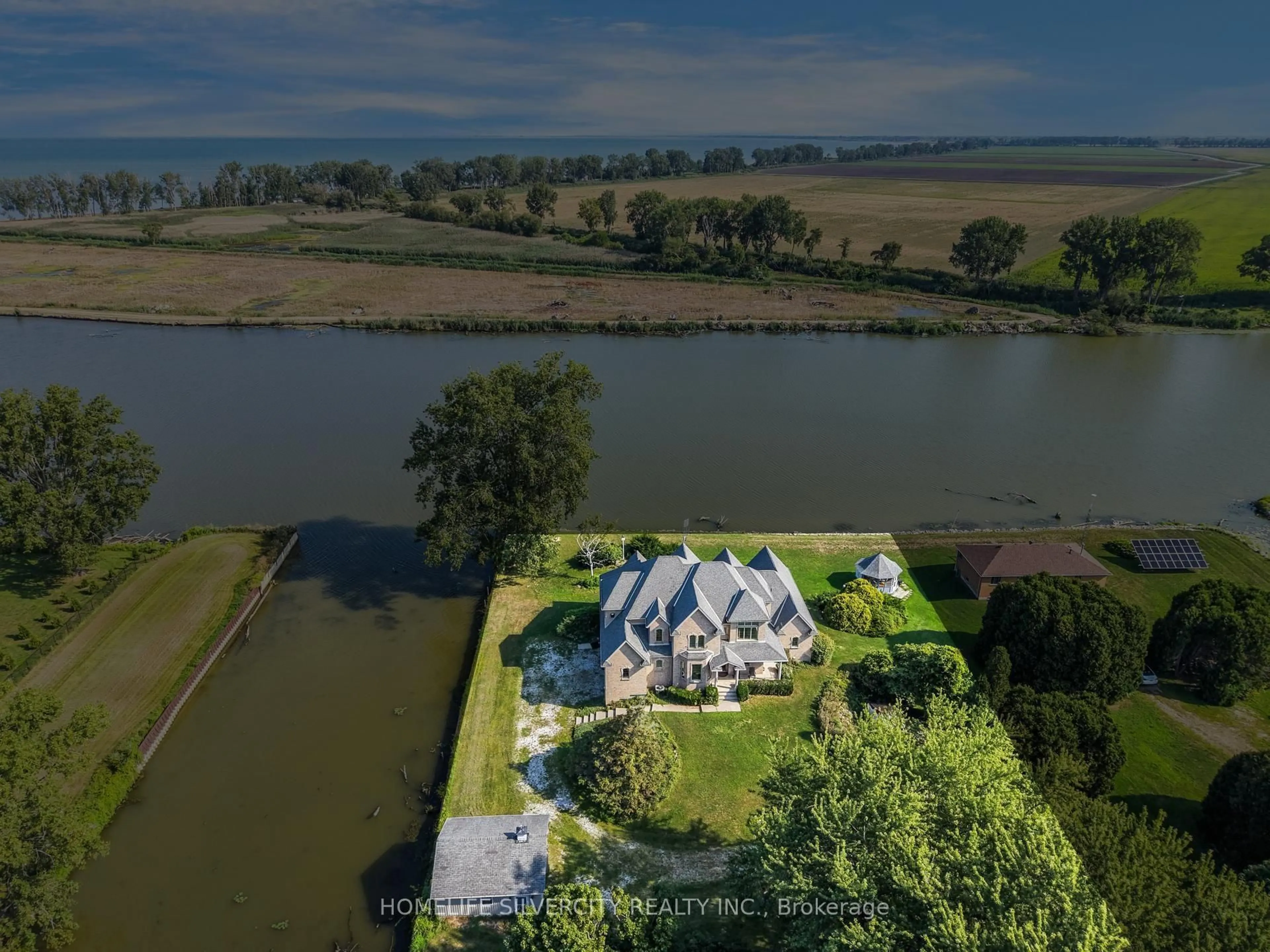 A pic from outside/outdoor area/front of a property/back of a property/a pic from drone, water/lake/river/ocean view for 21000 Admiral Dr, Lakeshore Ontario N0P 2L0