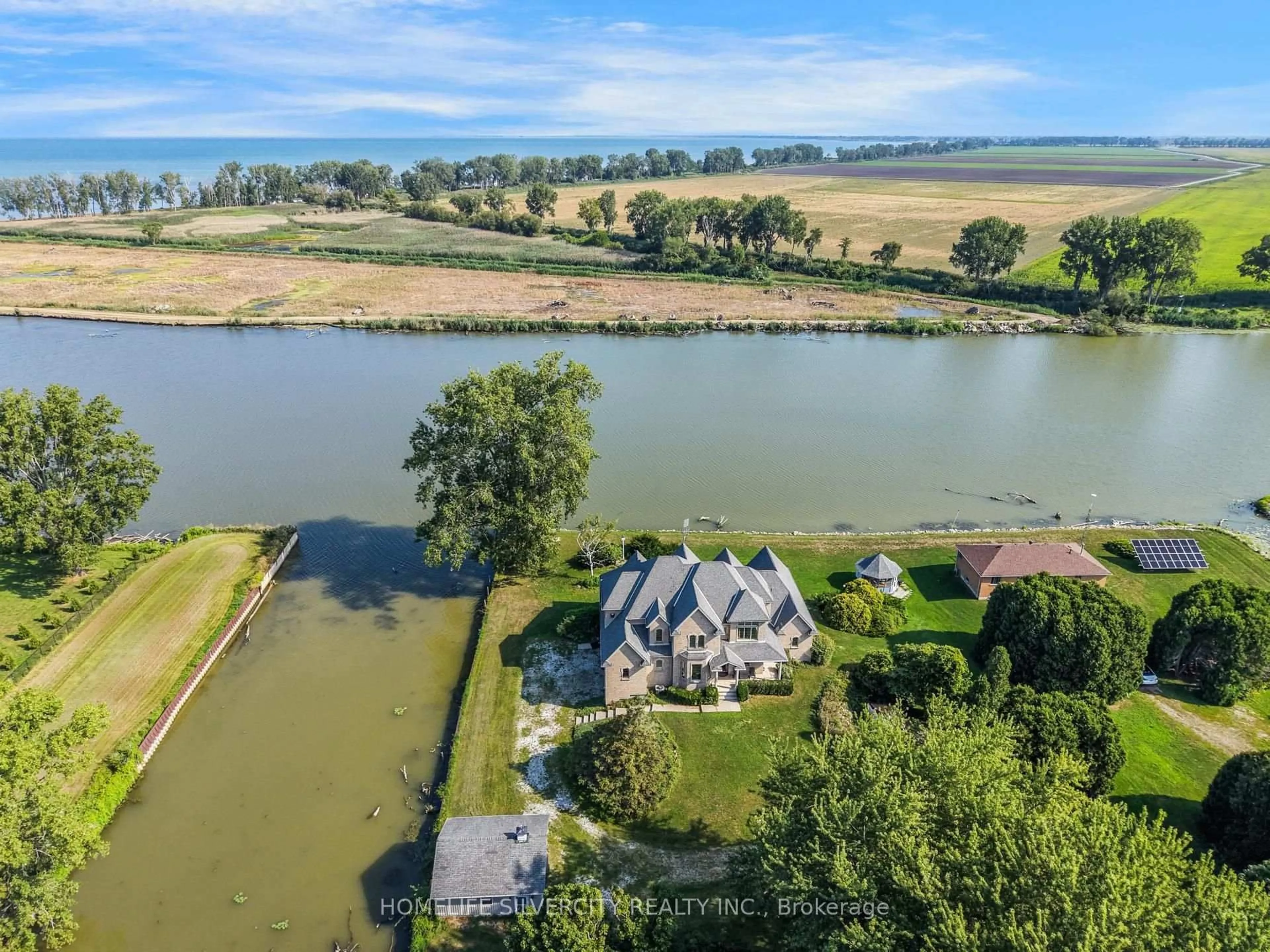 A pic from outside/outdoor area/front of a property/back of a property/a pic from drone, water/lake/river/ocean view for 21000 Admiral Dr, Lakeshore Ontario N0P 2L0