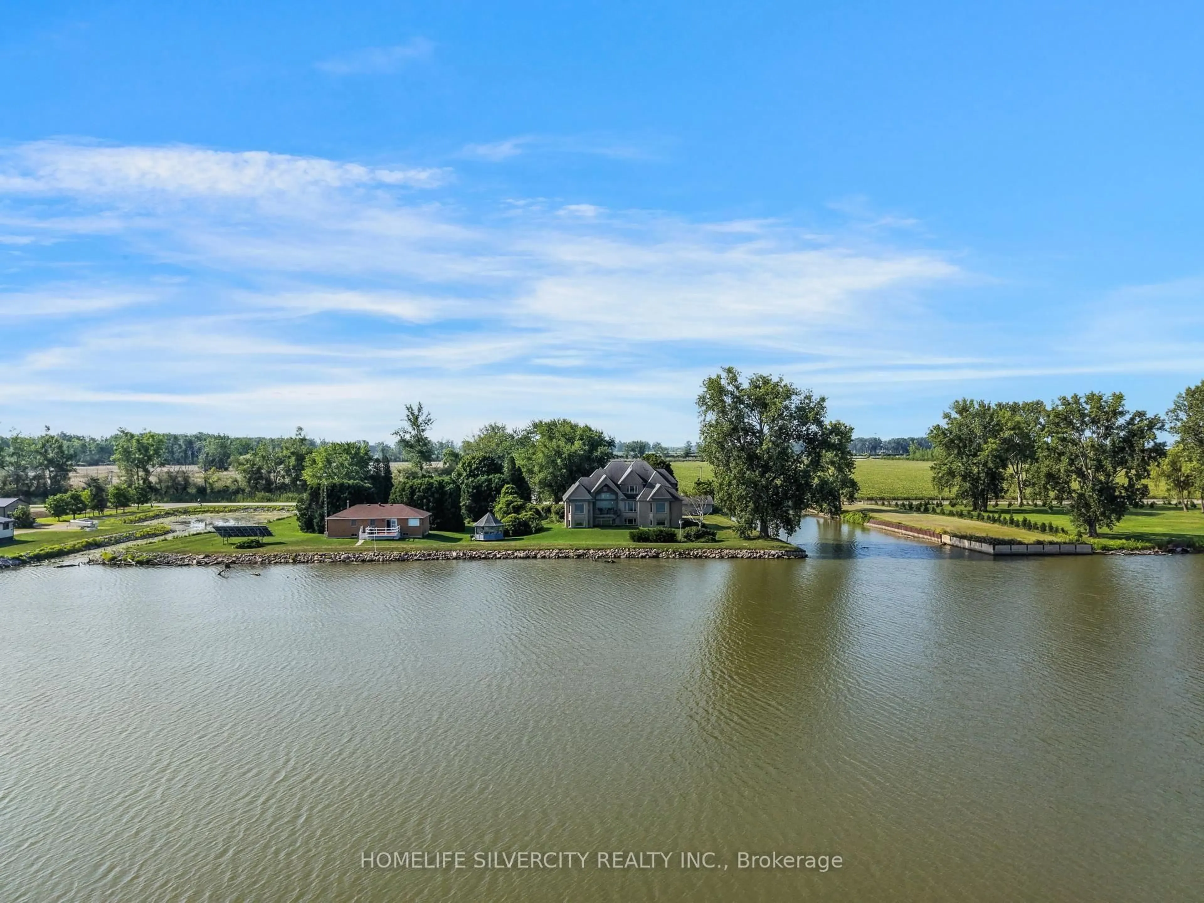 A pic from outside/outdoor area/front of a property/back of a property/a pic from drone, water/lake/river/ocean view for 21000 Admiral Dr, Lakeshore Ontario N0P 2L0
