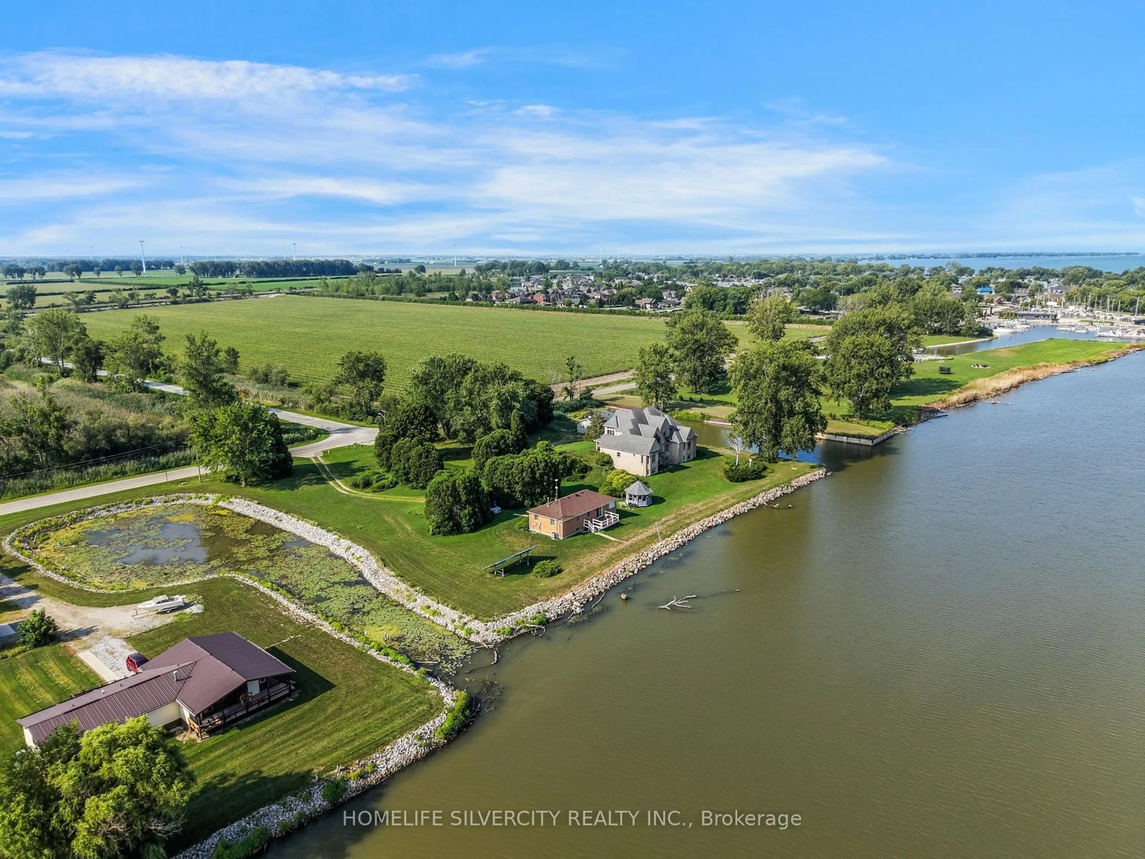 A pic from outside/outdoor area/front of a property/back of a property/a pic from drone, water/lake/river/ocean view for 21000 Admiral Dr, Lakeshore Ontario N0P 2L0