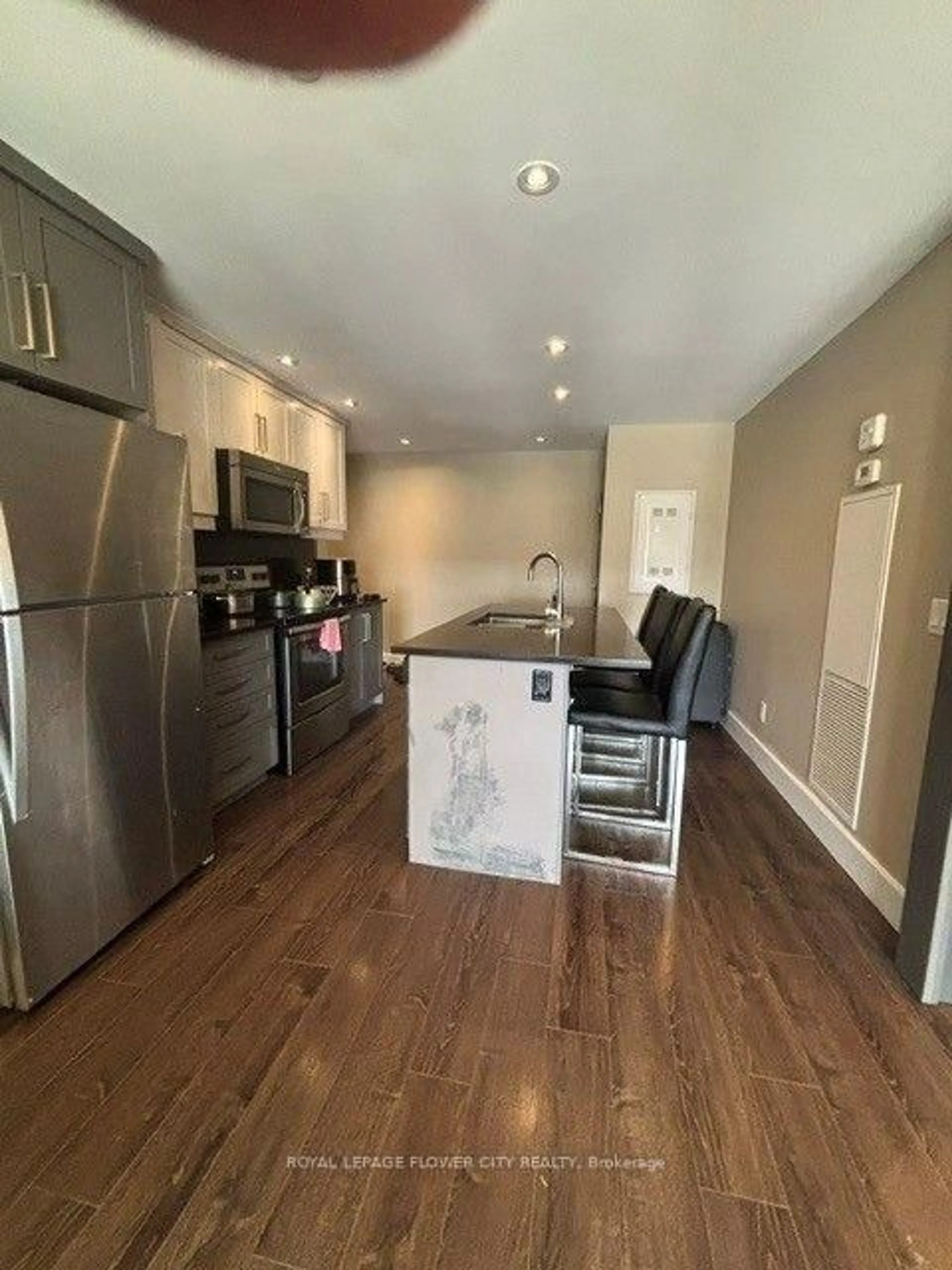 Open concept kitchen, wood/laminate floor for 330 Phillip St #1002, Waterloo Ontario N2L 3W9