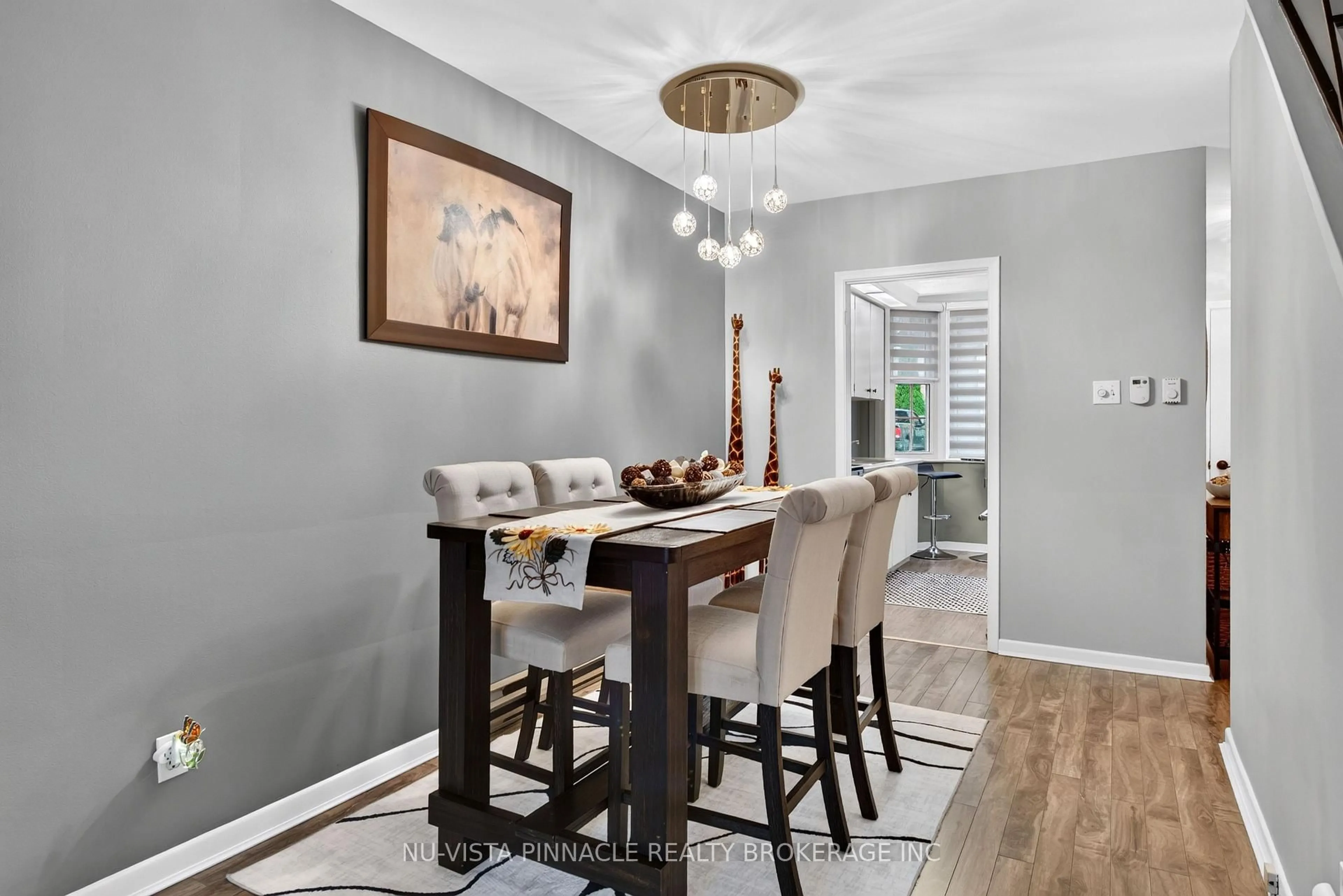 Dining room, wood/laminate floor for 7 Arbour Glen Cres, London East Ontario N5Y 1Z9