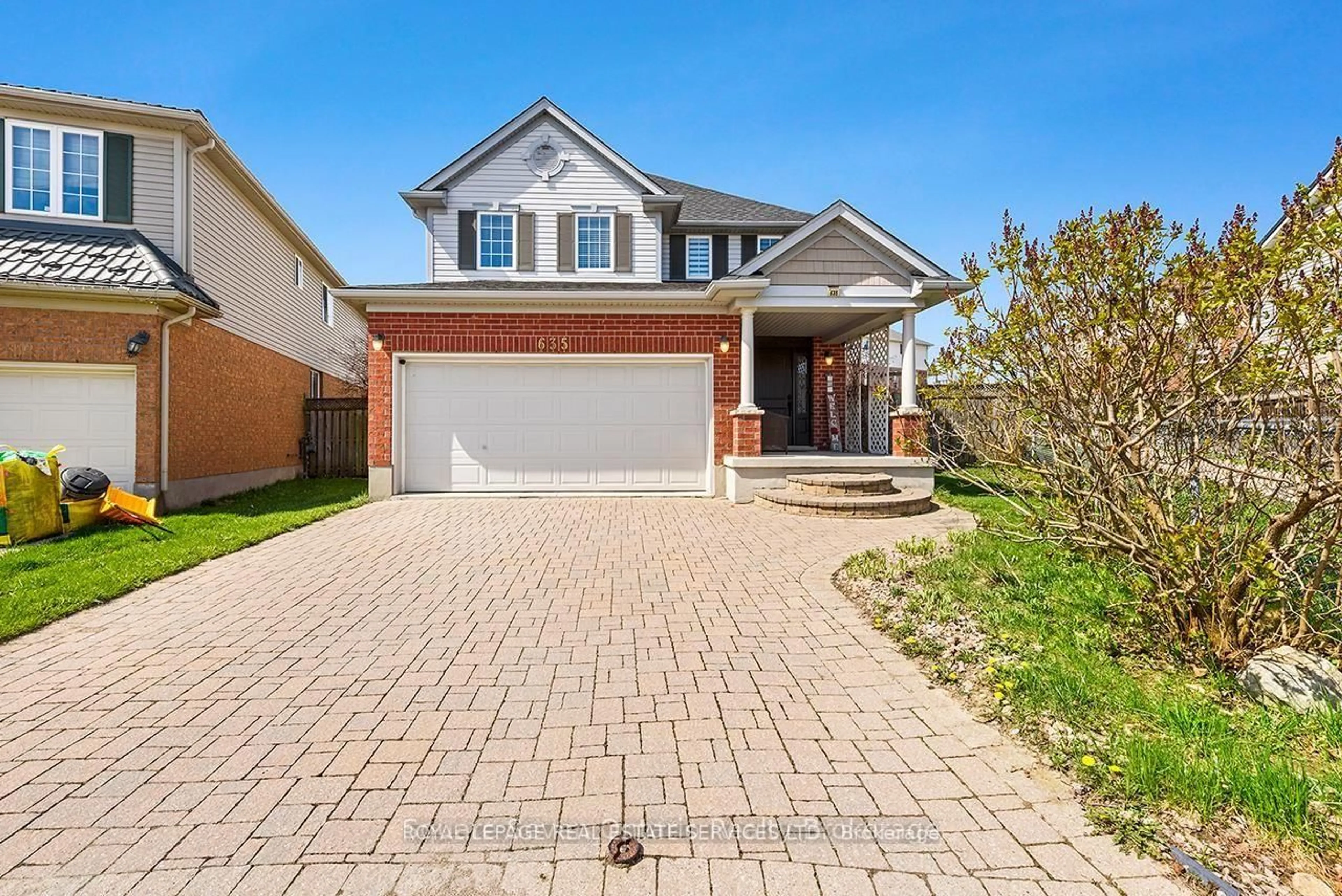 Home with brick exterior material, street for 635 Commonwealth Cres, Kitchener Ontario N2E 4J9