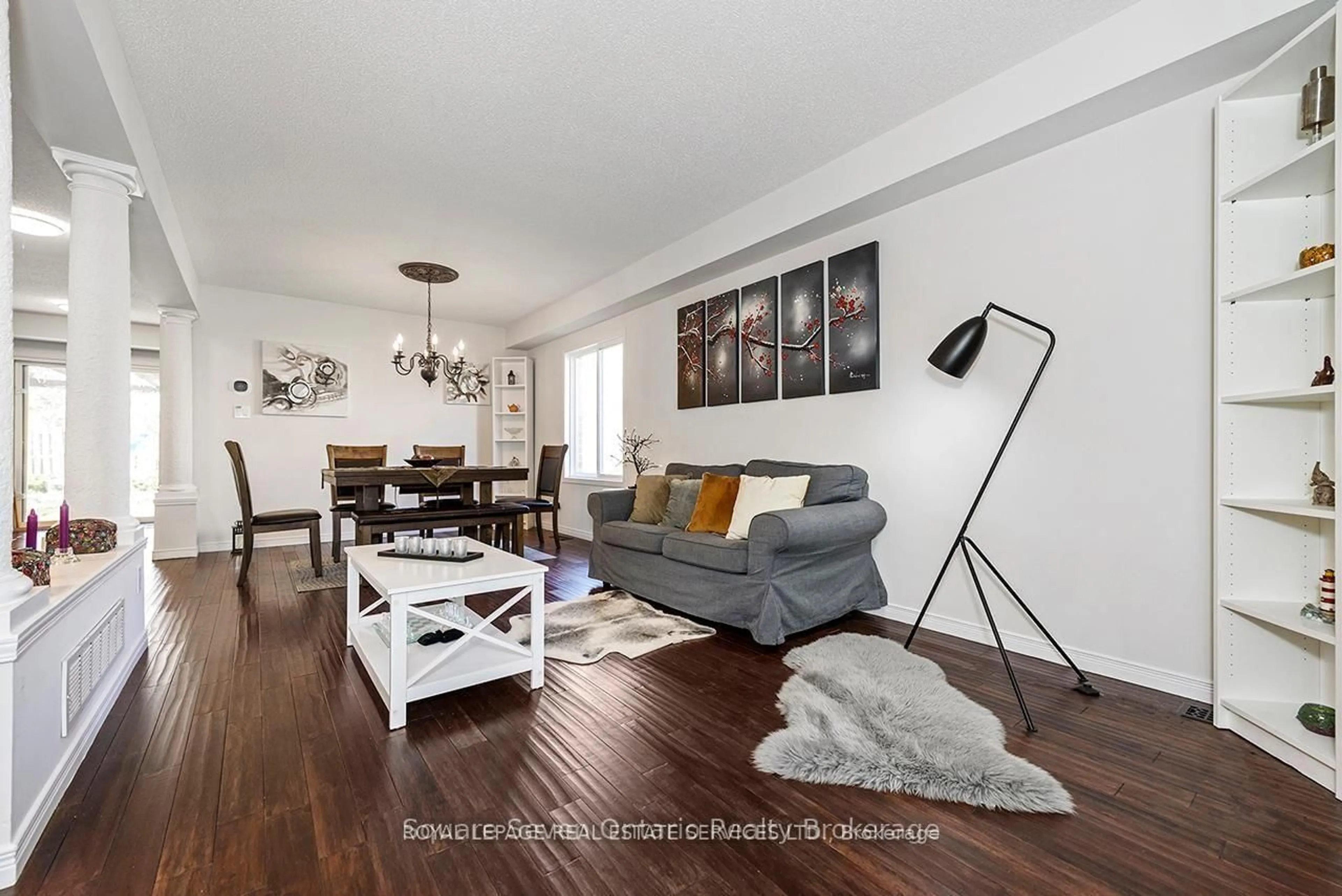 Living room with furniture, wood/laminate floor for 635 Commonwealth Cres, Kitchener Ontario N2E 4J9