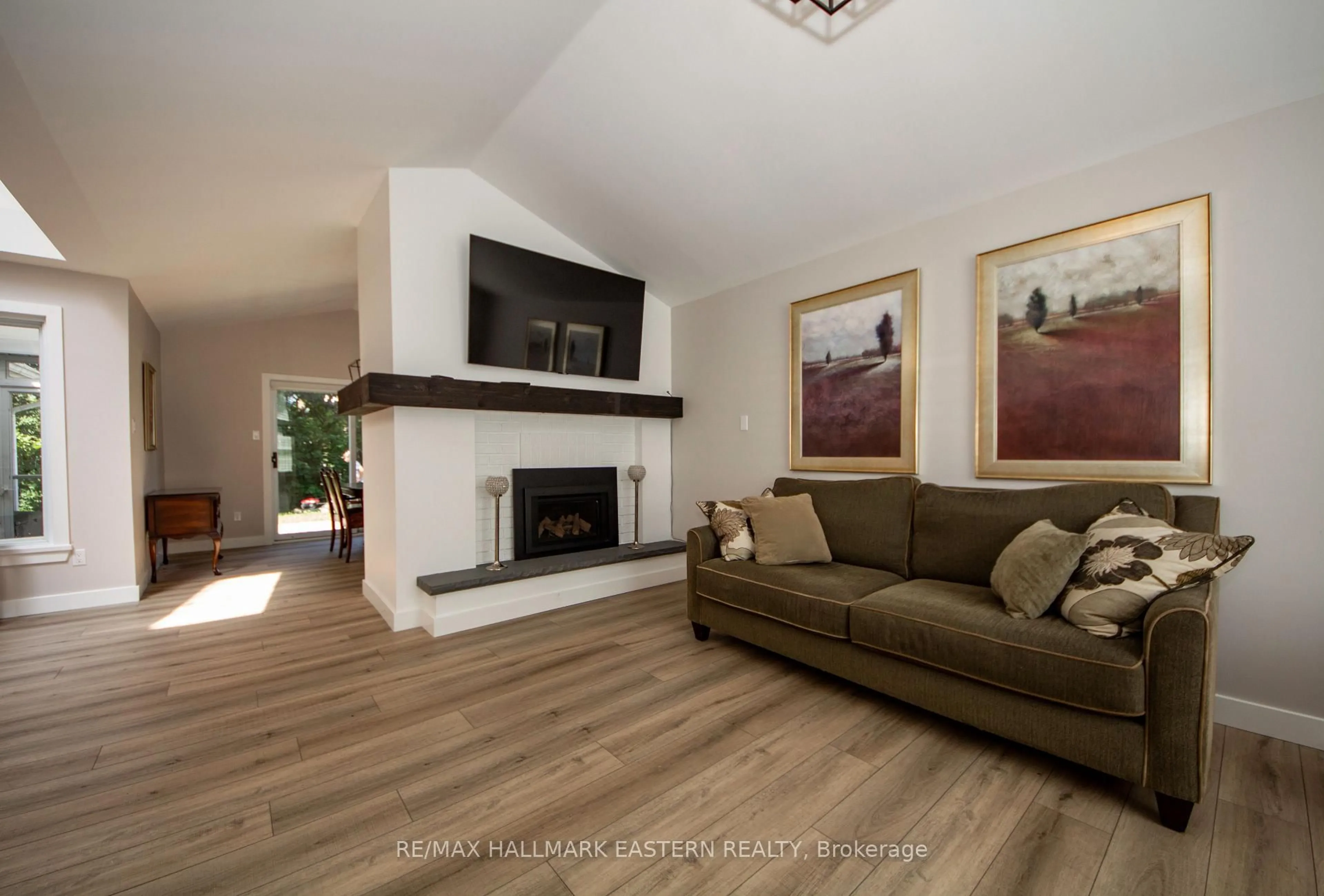 Living room with furniture, wood/laminate floor for 36 Russell Hill Rd, Kawartha Lakes Ontario K0M 1A0