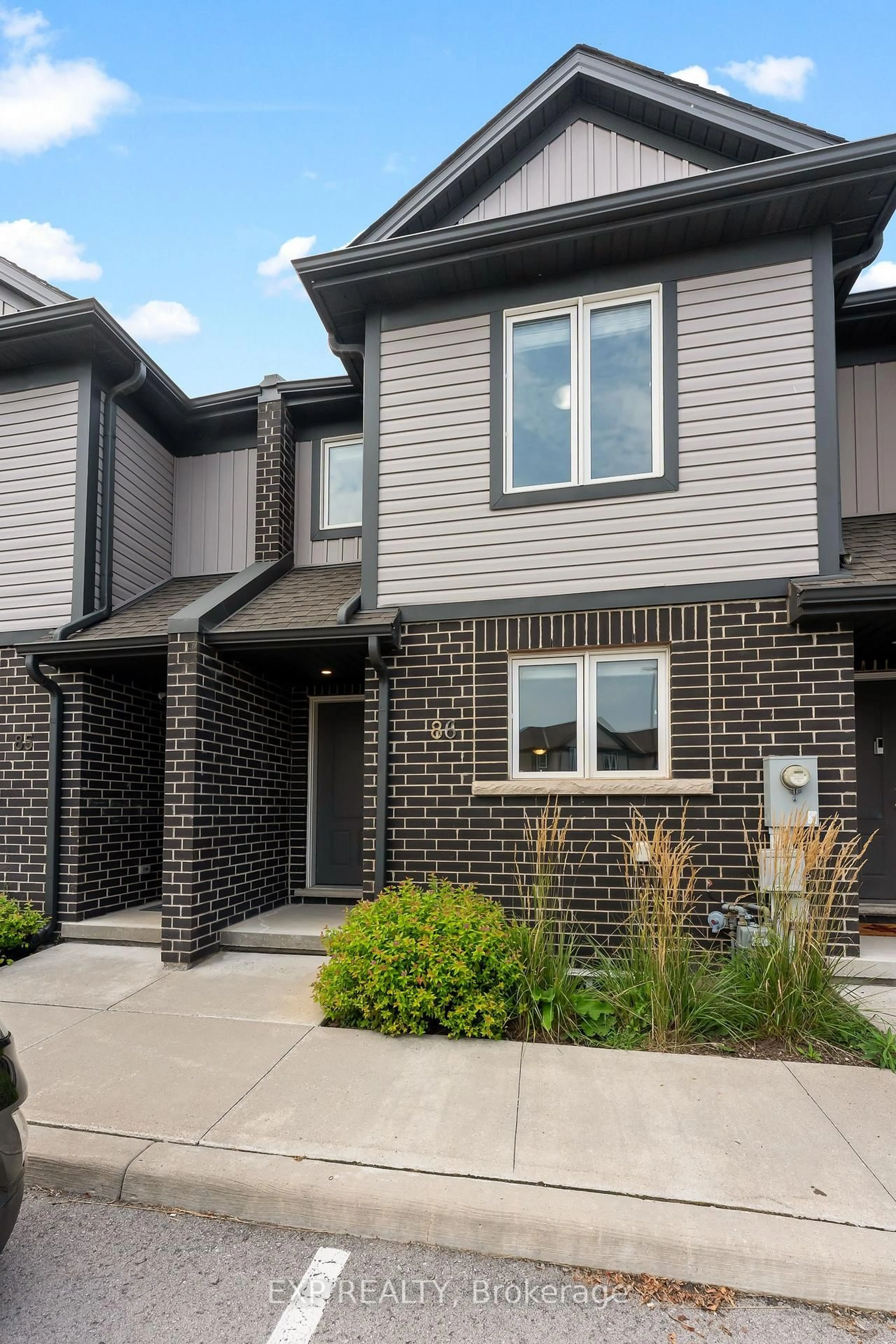 Home with brick exterior material, street for 7768 Ascot Circ #86, Niagara Falls Ontario L2H 3P9