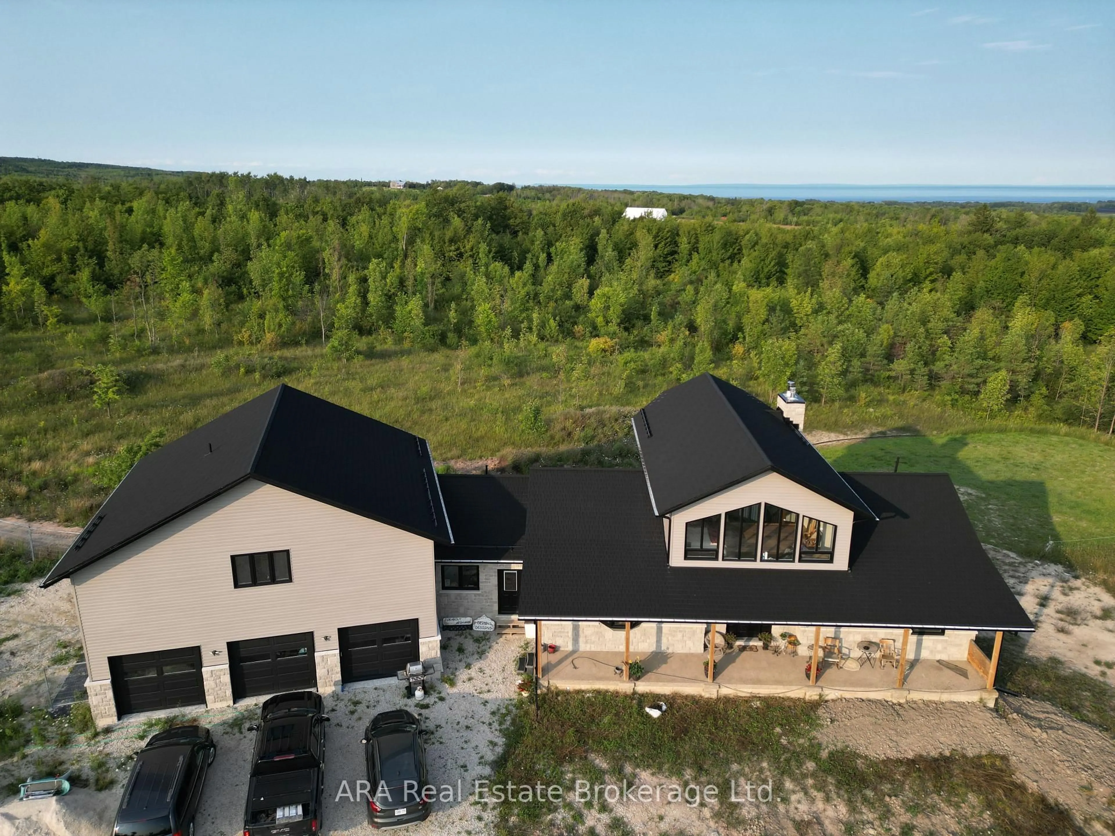 A pic from outside/outdoor area/front of a property/back of a property/a pic from drone, water/lake/river/ocean view for 245211 22 Sdrd, Meaford Ontario N4L 1W5