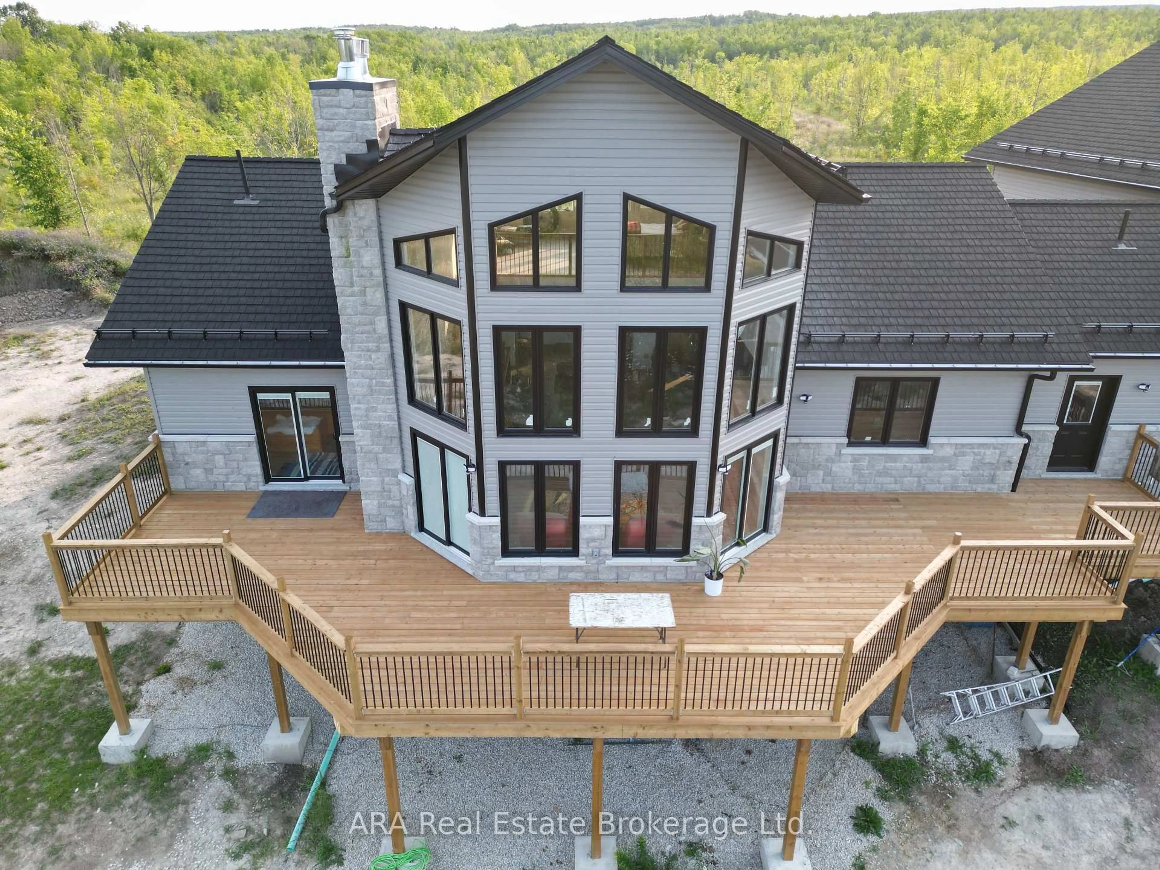 A pic from outside/outdoor area/front of a property/back of a property/a pic from drone, mountain view for 245211 22 Sdrd, Meaford Ontario N4L 1W5