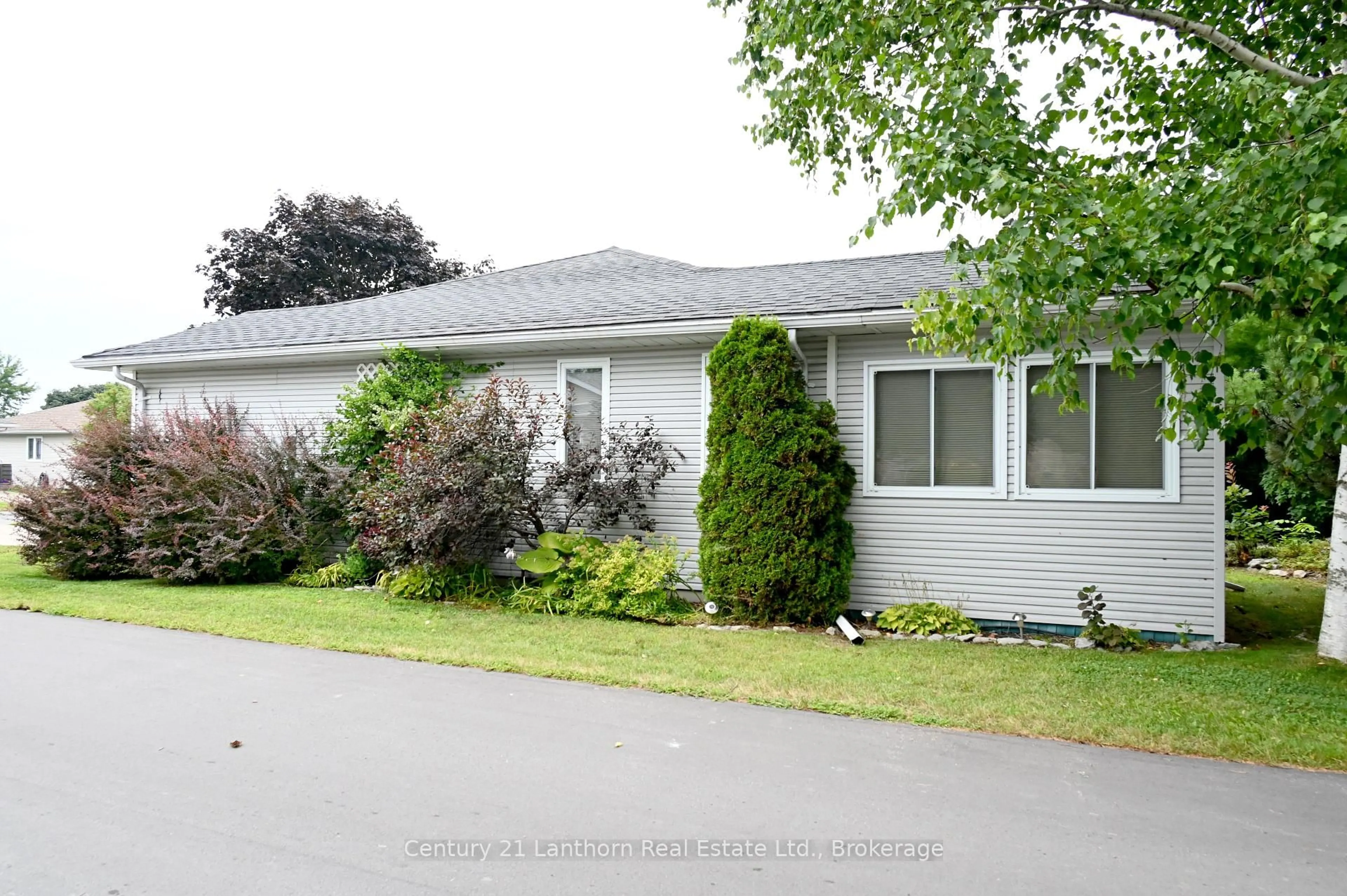 Home with vinyl exterior material, street for 1 Reynolds Pl, Prince Edward County Ontario K0K 3L0