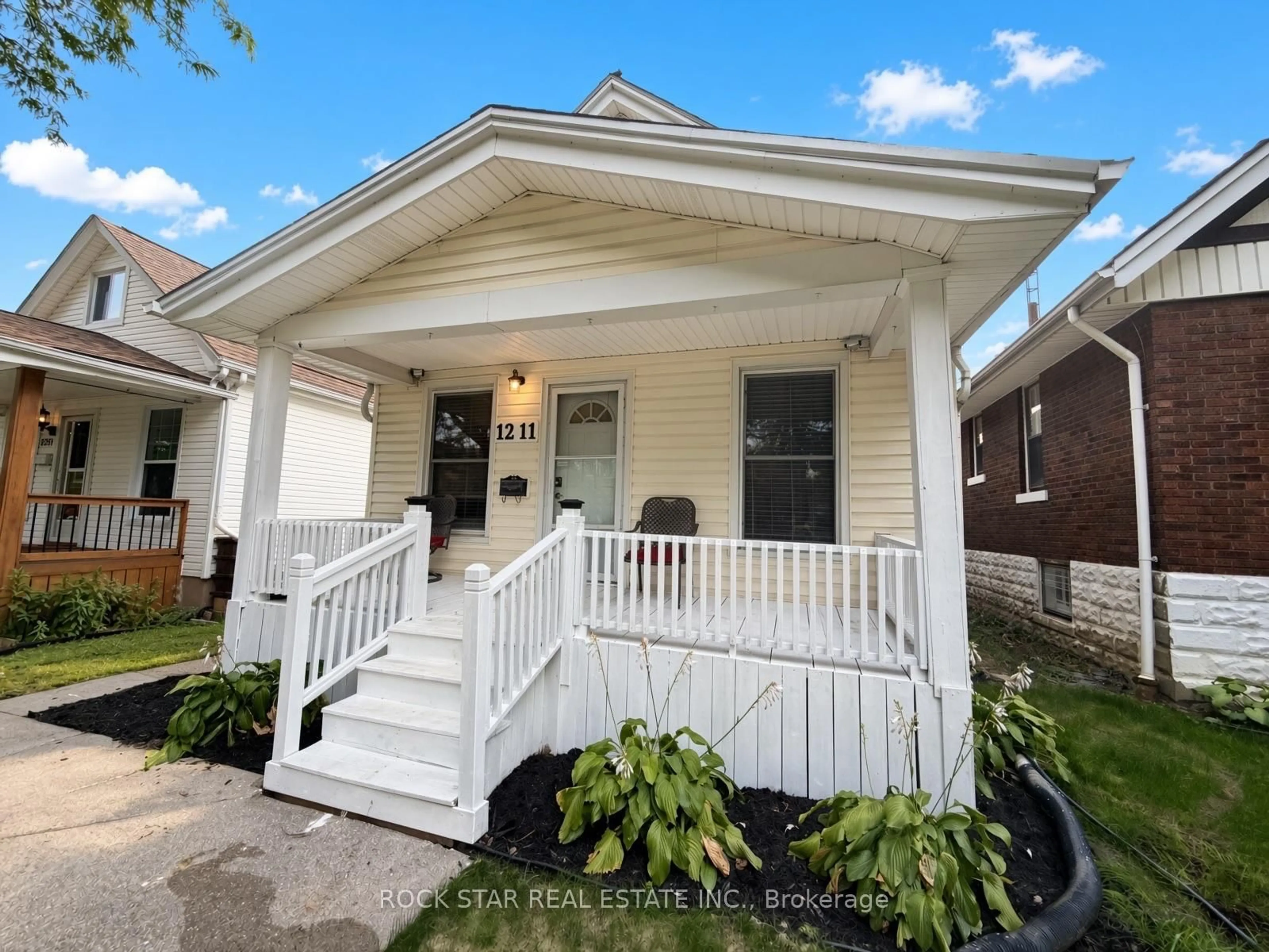 Home with vinyl exterior material, street for 1211 Lincoln Rd, Windsor Ontario N8Y 2H9