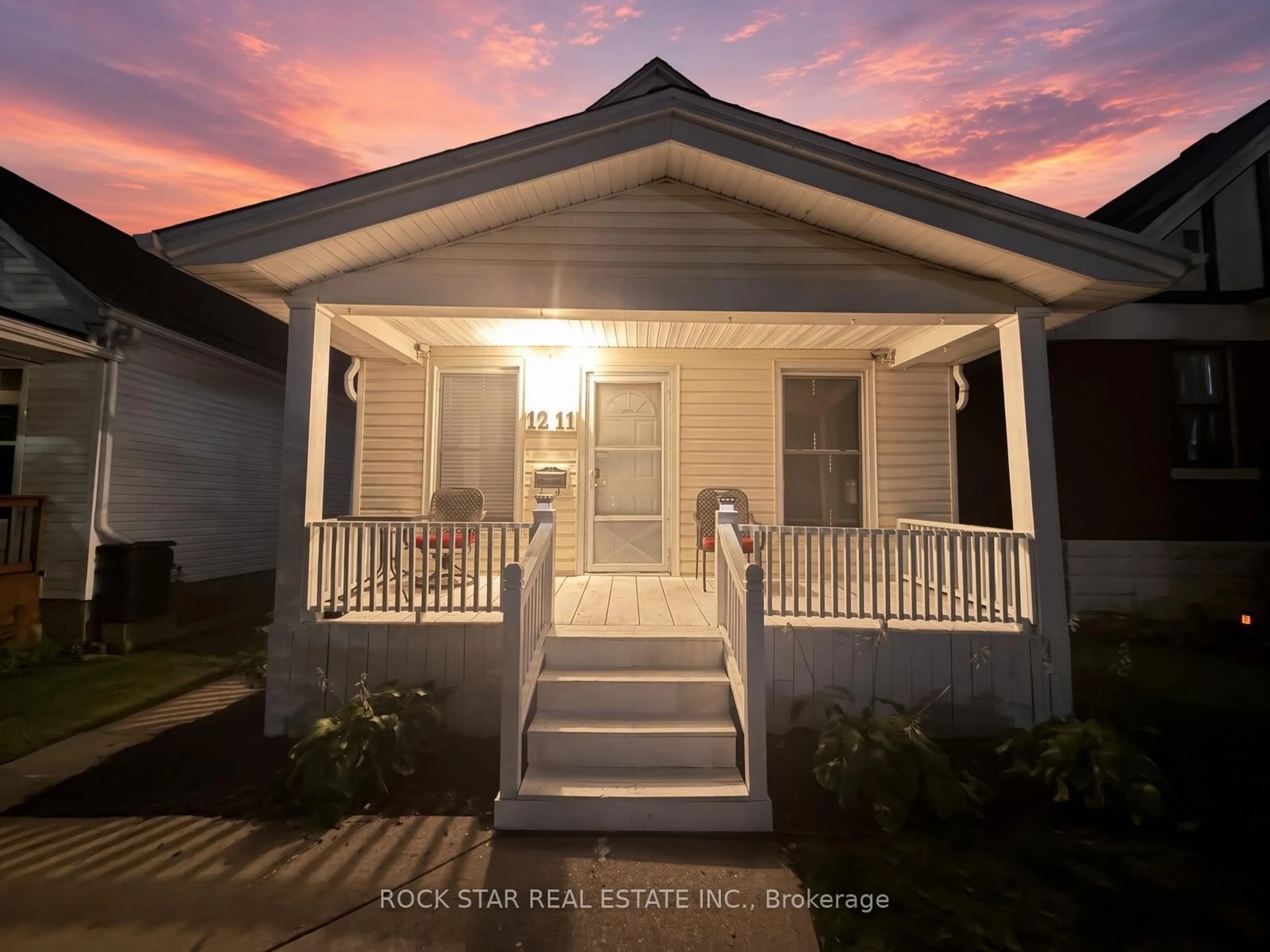 Home with vinyl exterior material, street for 1211 Lincoln Rd, Windsor Ontario N8Y 2H9
