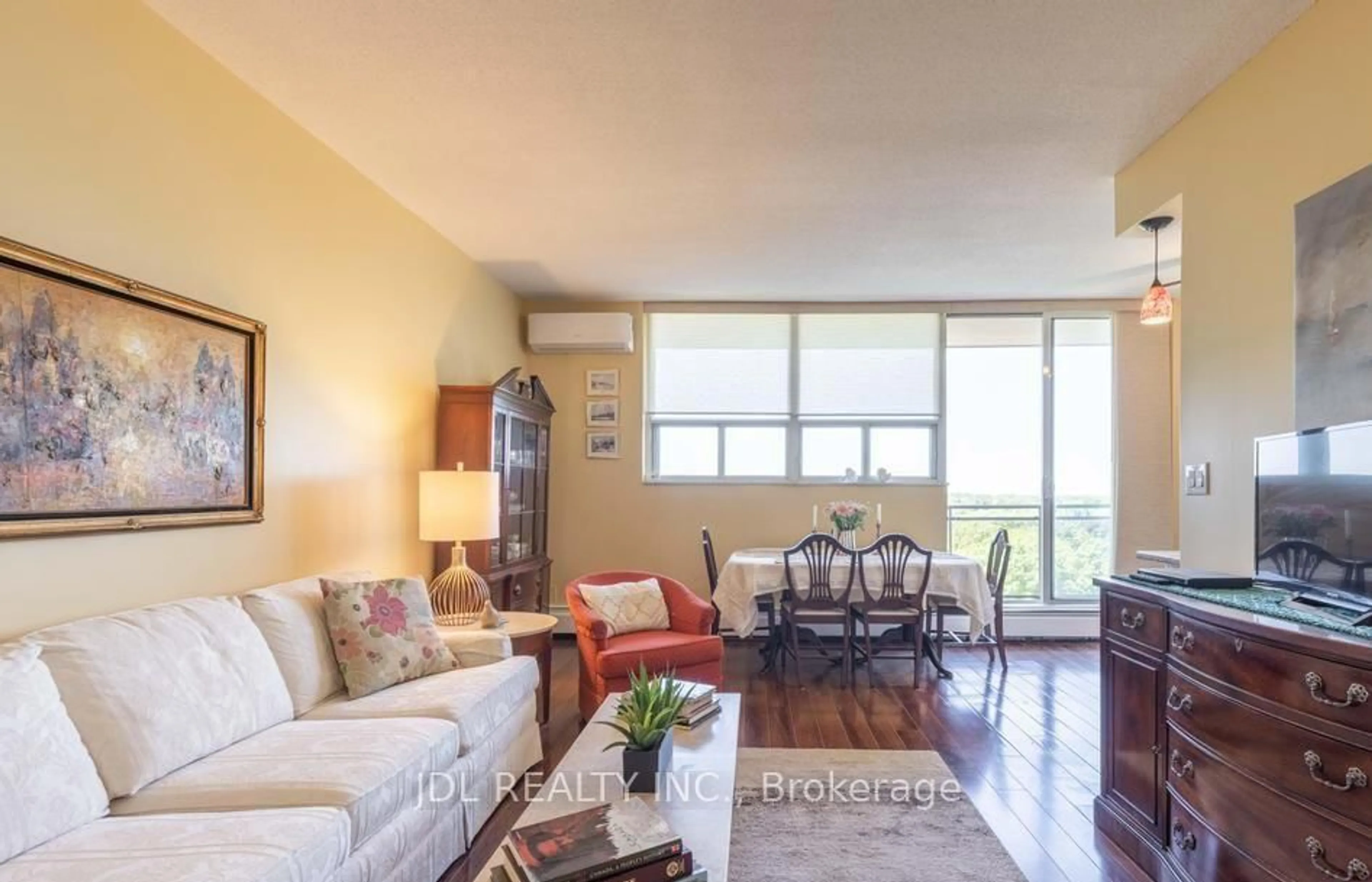 Living room with furniture, wood/laminate floor for 6400 Huggins St #908, Niagara Falls Ontario L2J 3G5