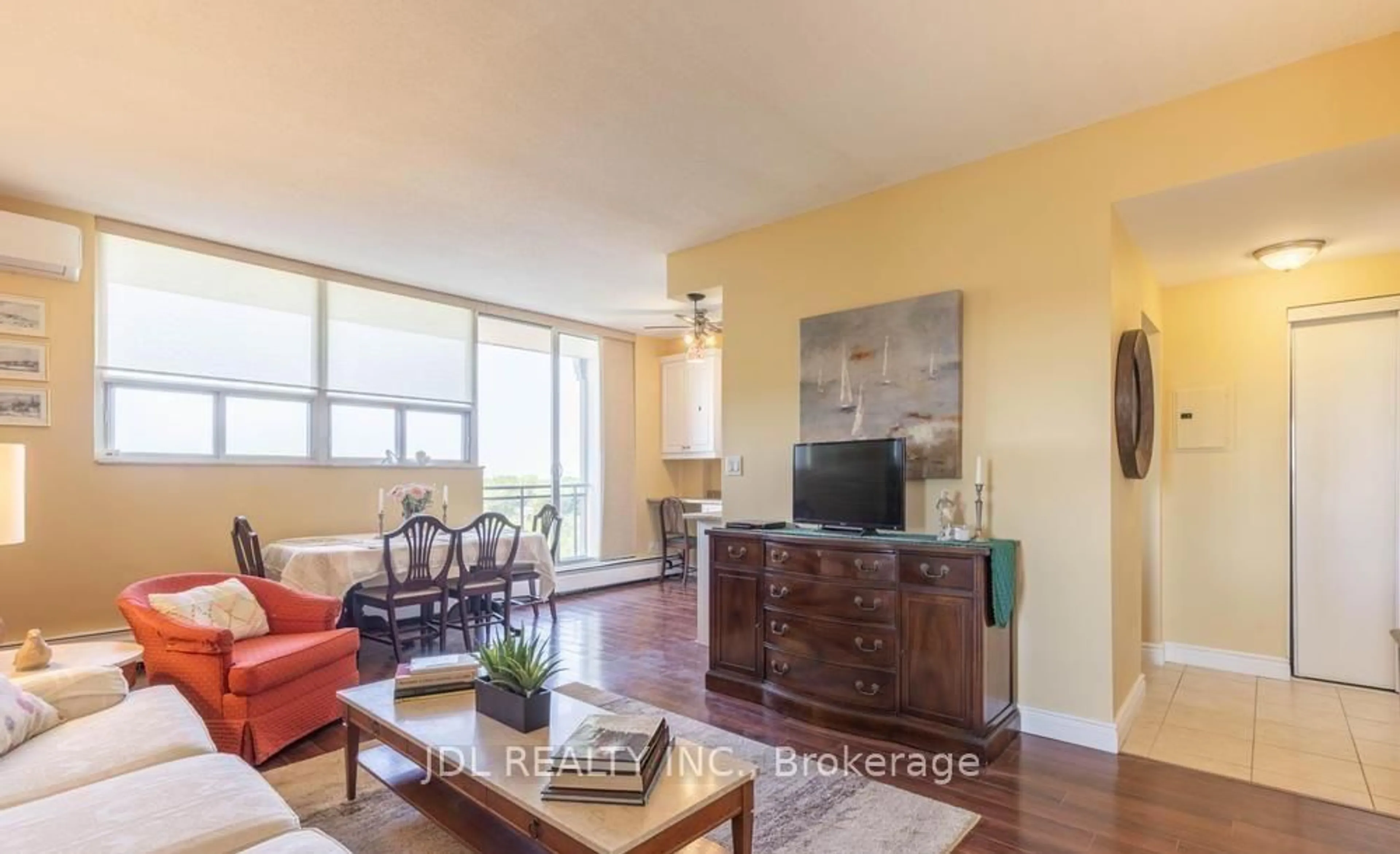 Living room with furniture, wood/laminate floor for 6400 Huggins St #908, Niagara Falls Ontario L2J 3G5