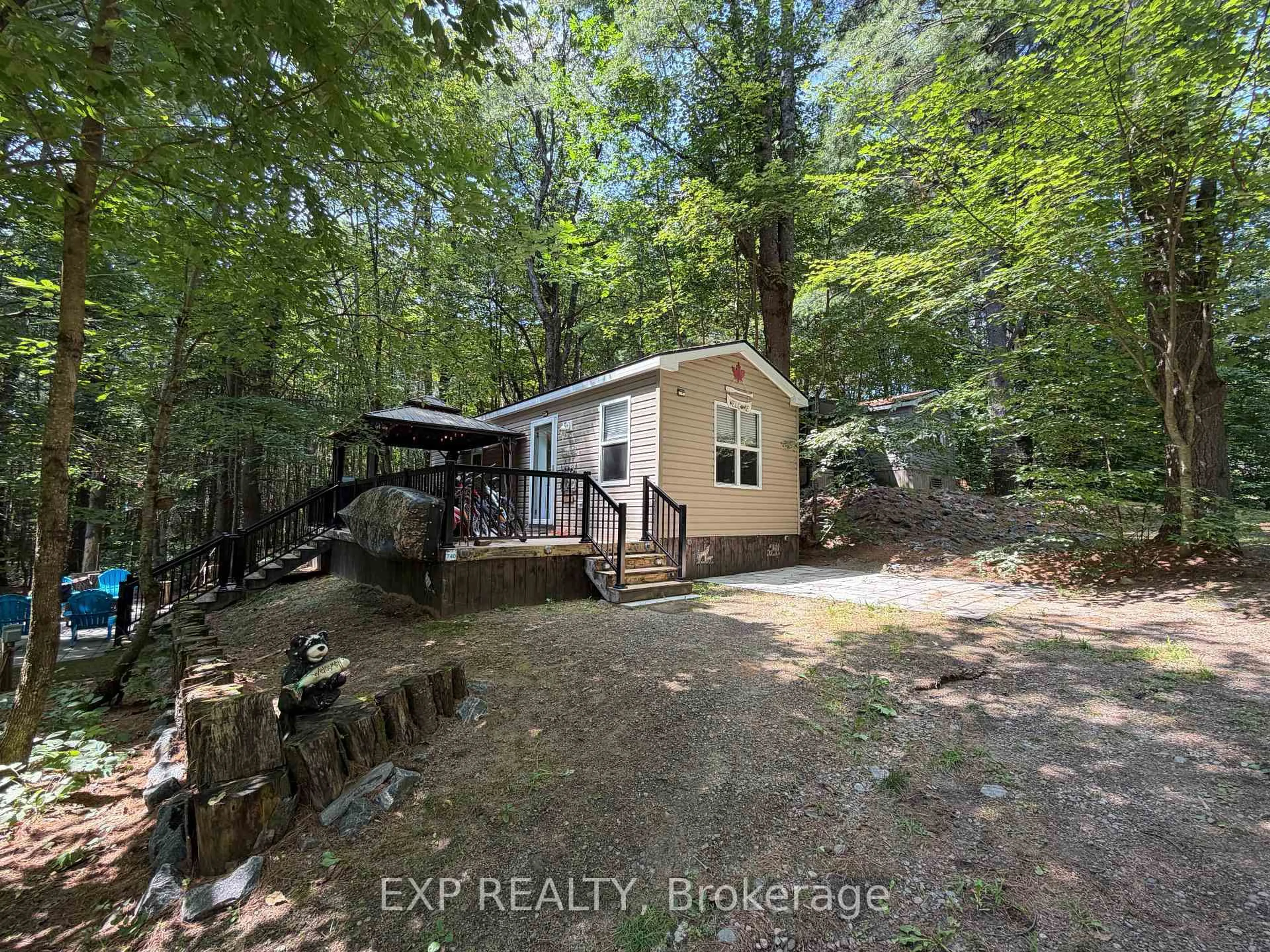 A pic from outside/outdoor area/front of a property/back of a property/a pic from drone, forest/trees view for 1047 Bonnie Lake Camp Rd #740 Poplar Cres, Bracebridge Ontario P1L 1W9
