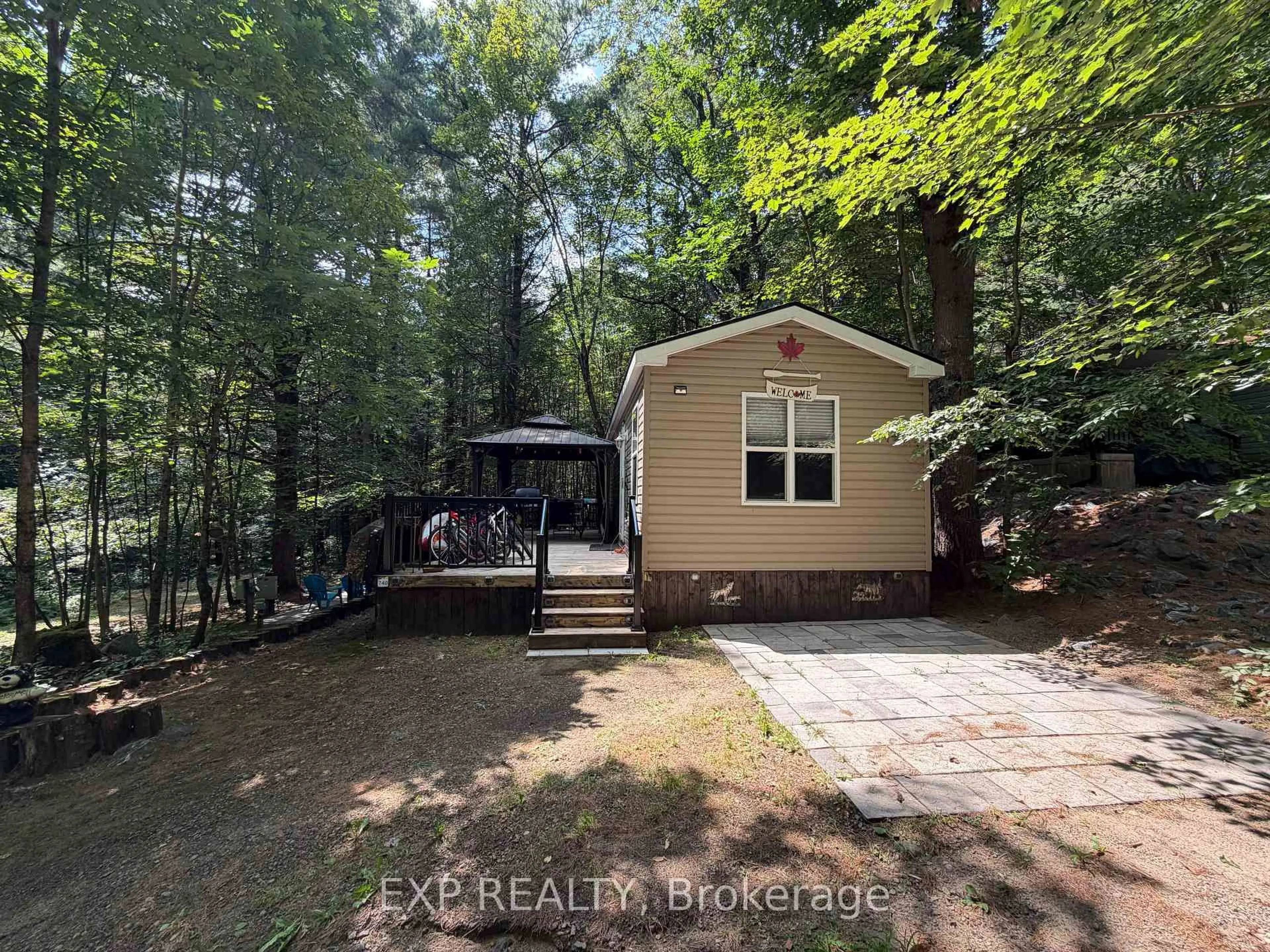 A pic from outside/outdoor area/front of a property/back of a property/a pic from drone, forest/trees view for 1047 Bonnie Lake Camp Rd #740 Poplar Cres, Bracebridge Ontario P1L 1W9