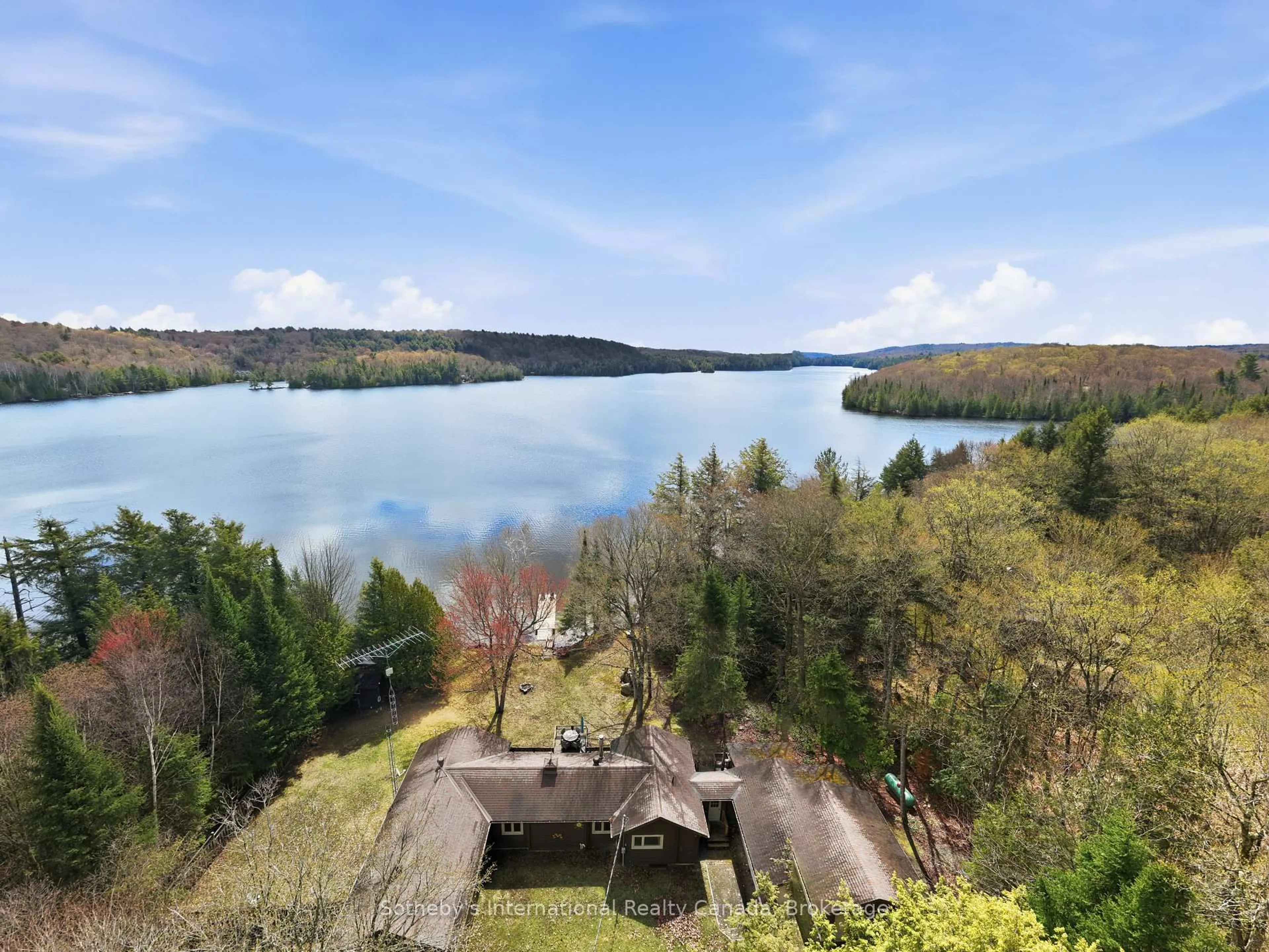 A pic from outside/outdoor area/front of a property/back of a property/a pic from drone, water/lake/river/ocean view for 1027 Scott Lane, Lake of Bays Ontario P1H 2J6