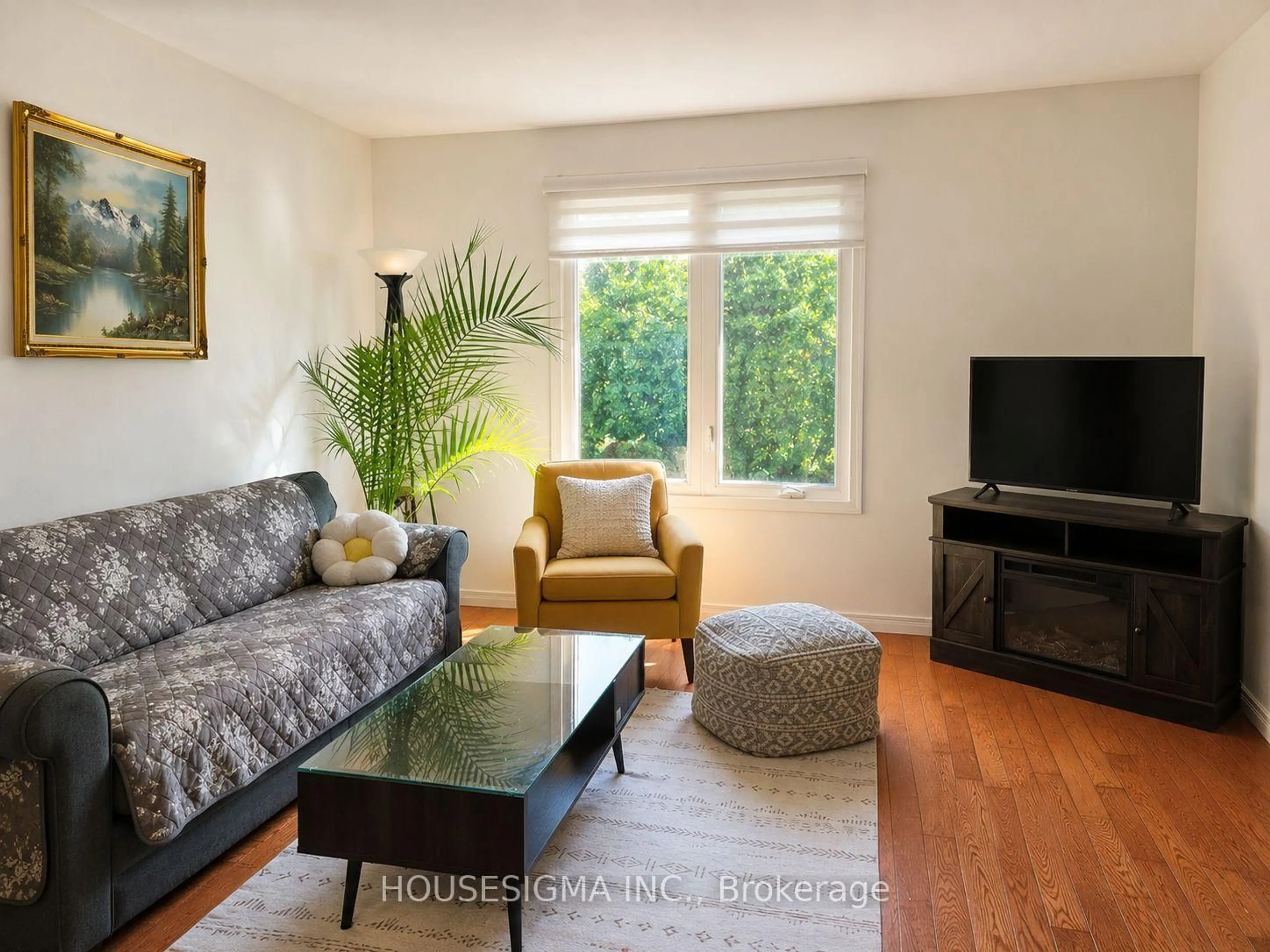 Living room with furniture, wood/laminate floor for 547 Barnes Cres, Peterborough Ontario K9J 7Z2