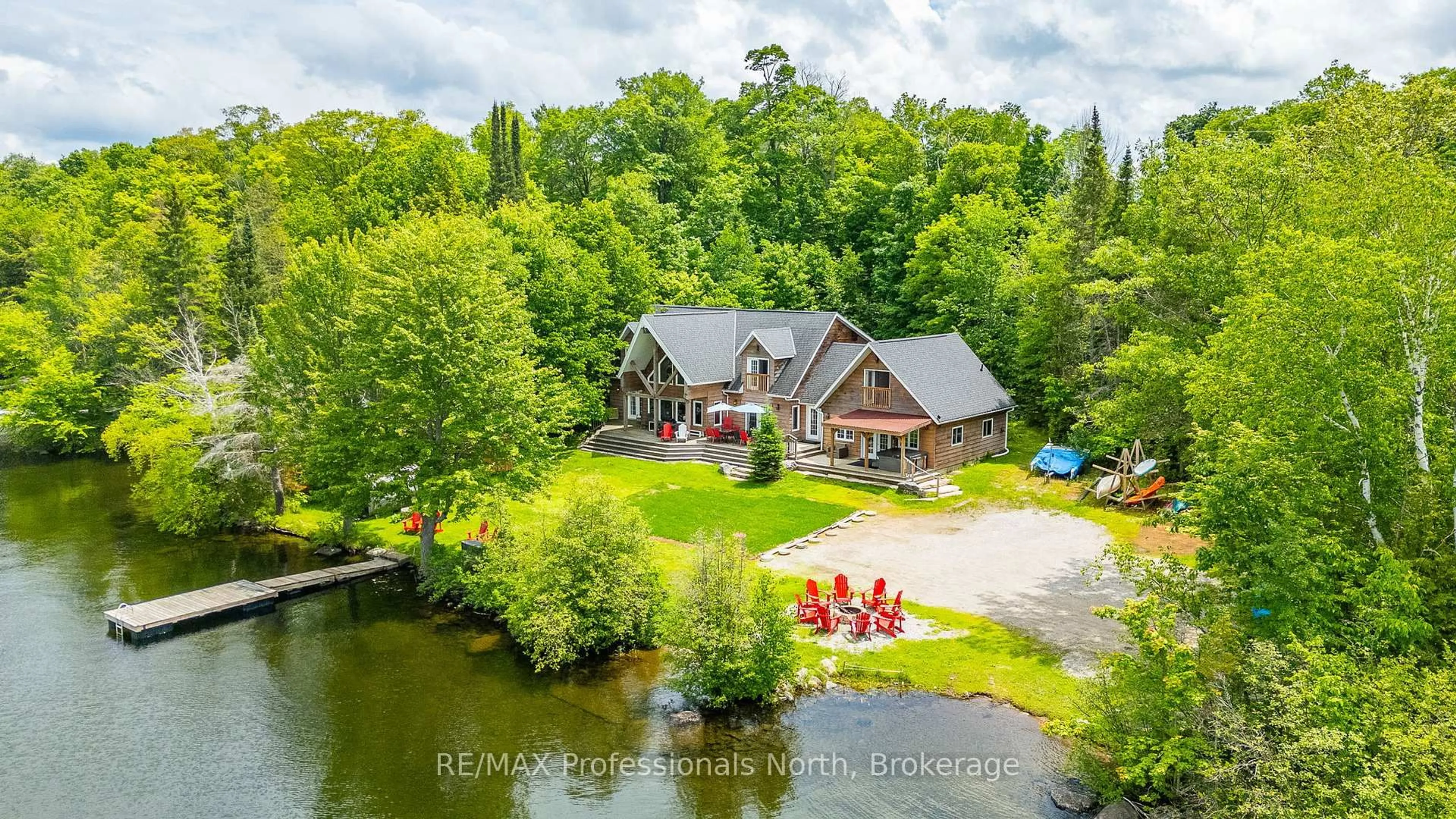 A pic from outside/outdoor area/front of a property/back of a property/a pic from drone, water/lake/river/ocean view for 17102 Highway 35, Algonquin Highlands Ontario K0M 1J1
