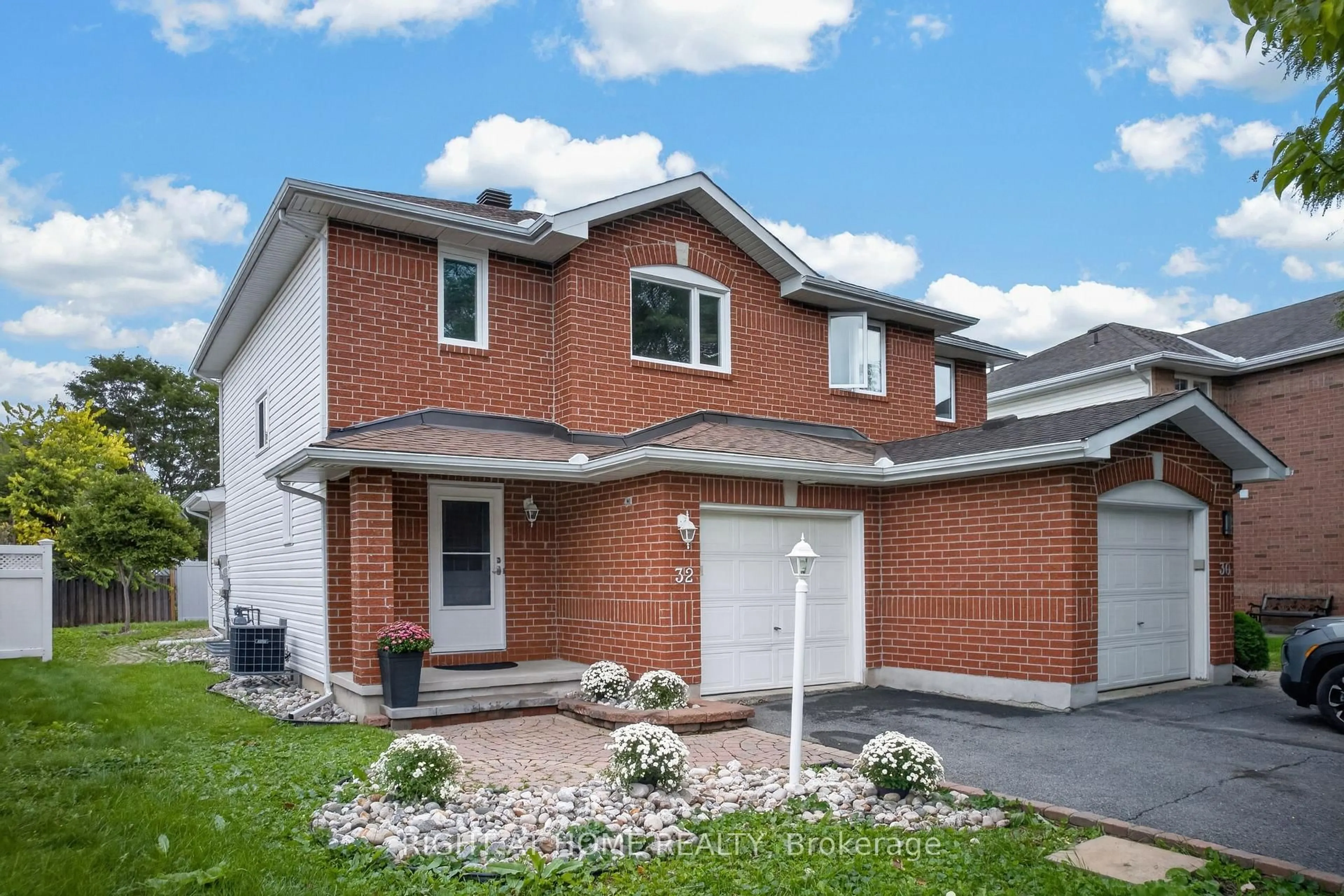 Home with brick exterior material, street for 32 Saffron Crt, Ottawa Ontario K2J 4R7