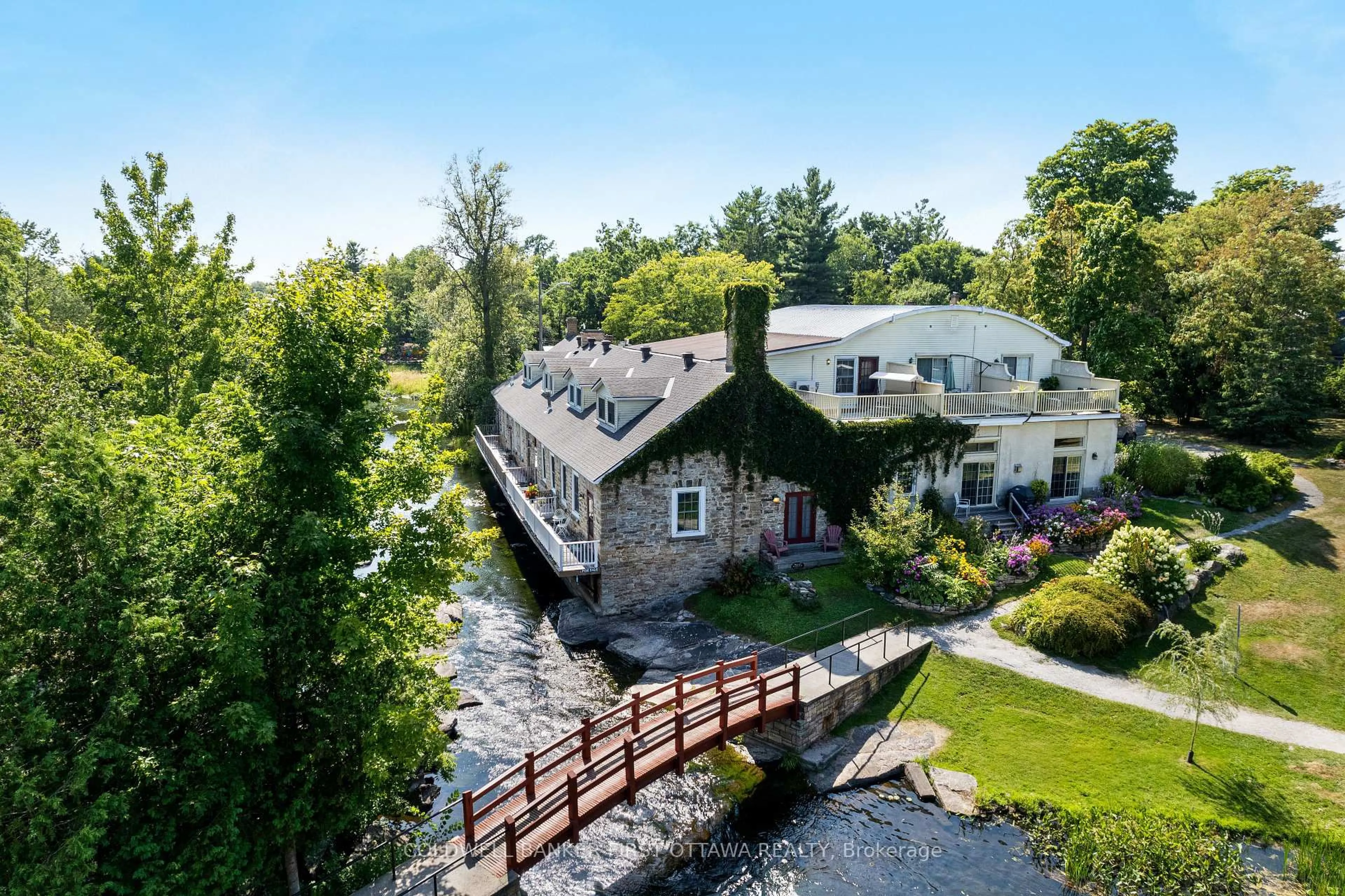 A pic from outside/outdoor area/front of a property/back of a property/a pic from drone, water/lake/river/ocean view for 7A Lewis St, Perth Ontario K7H 1M6