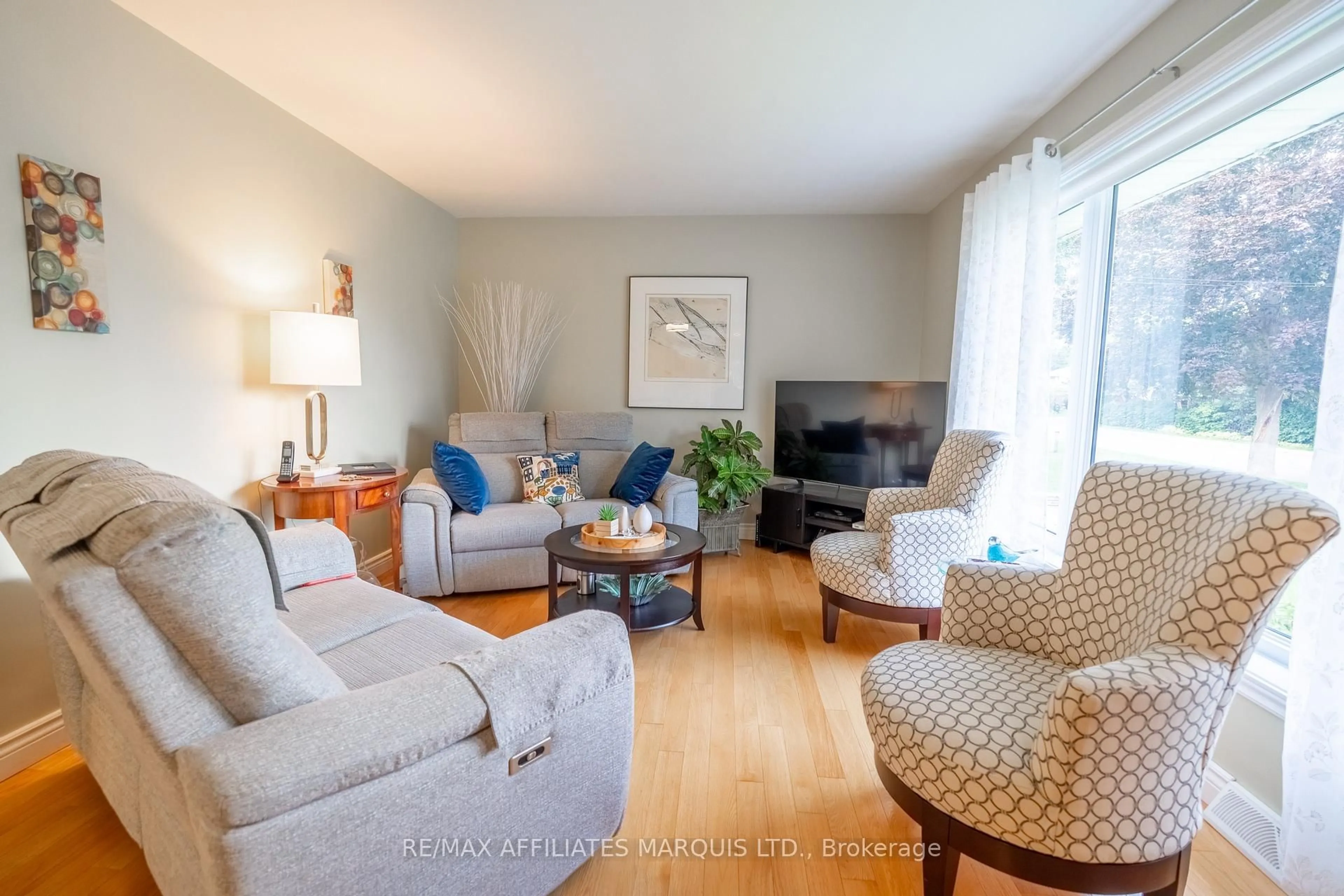 Living room with furniture, wood/laminate floor for 202 Shirley Ave, Cornwall Ontario K6J 2E5