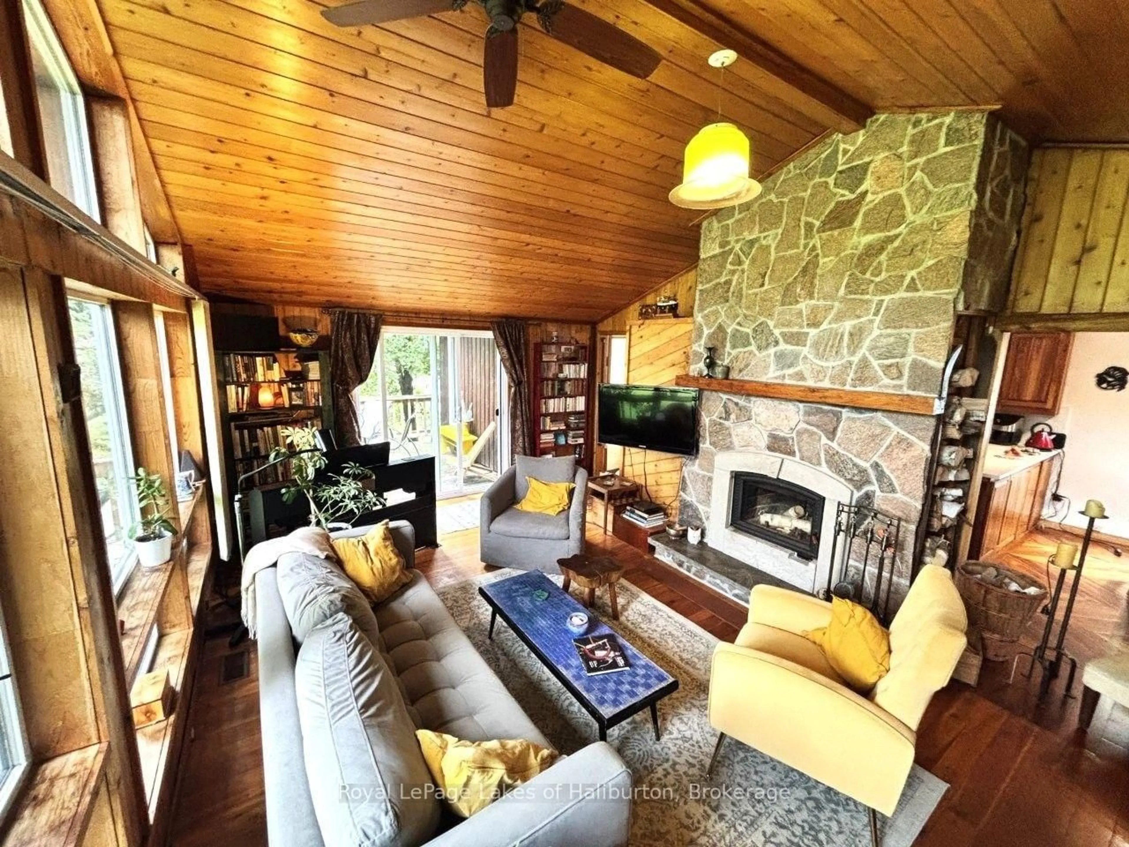 Living room with furniture, wood/laminate floor for 10 Nevison Dr, Kawartha Lakes Ontario K0M 2L0