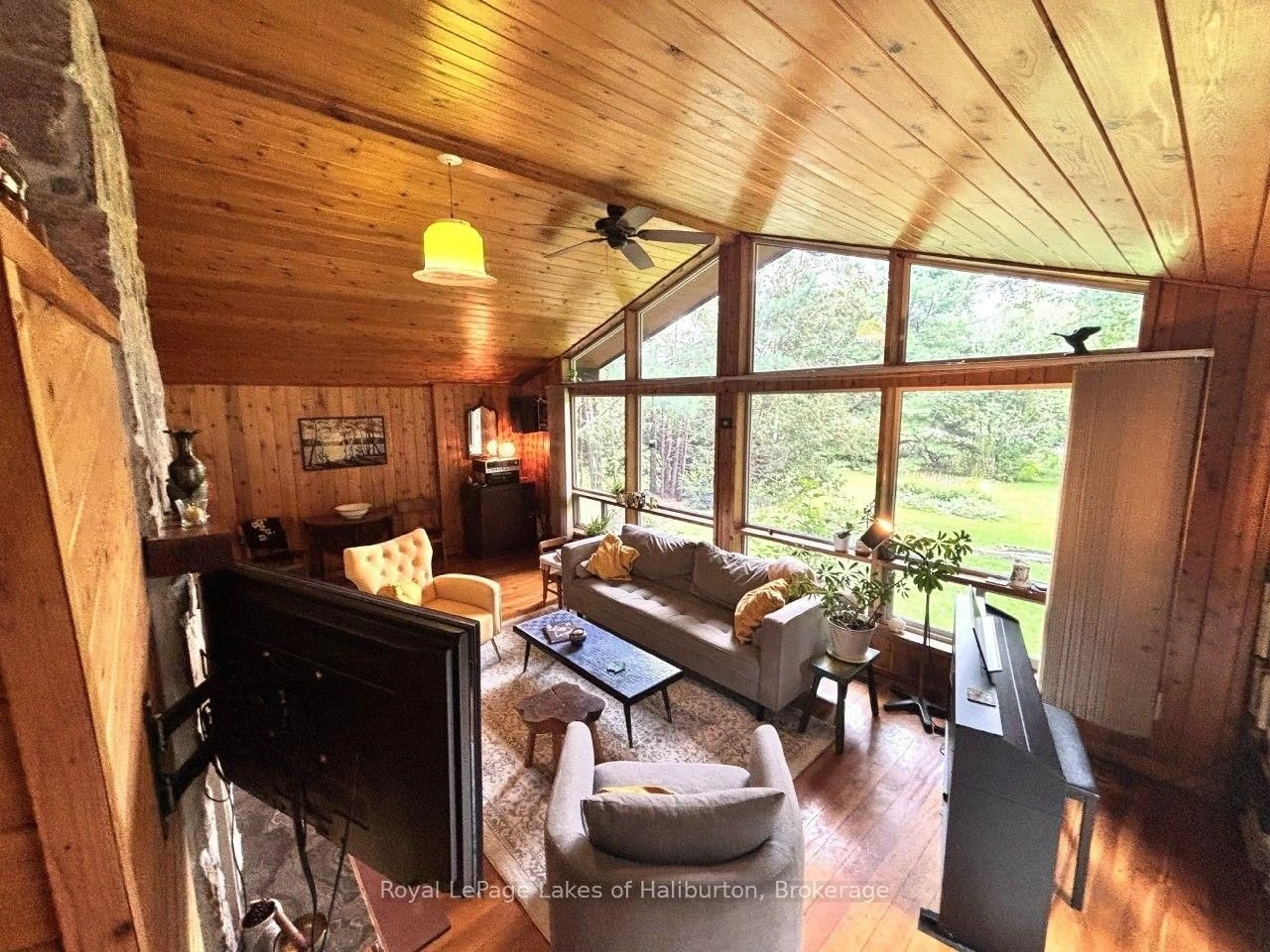 Living room with furniture, wood/laminate floor for 10 Nevison Dr, Kawartha Lakes Ontario K0M 2L0