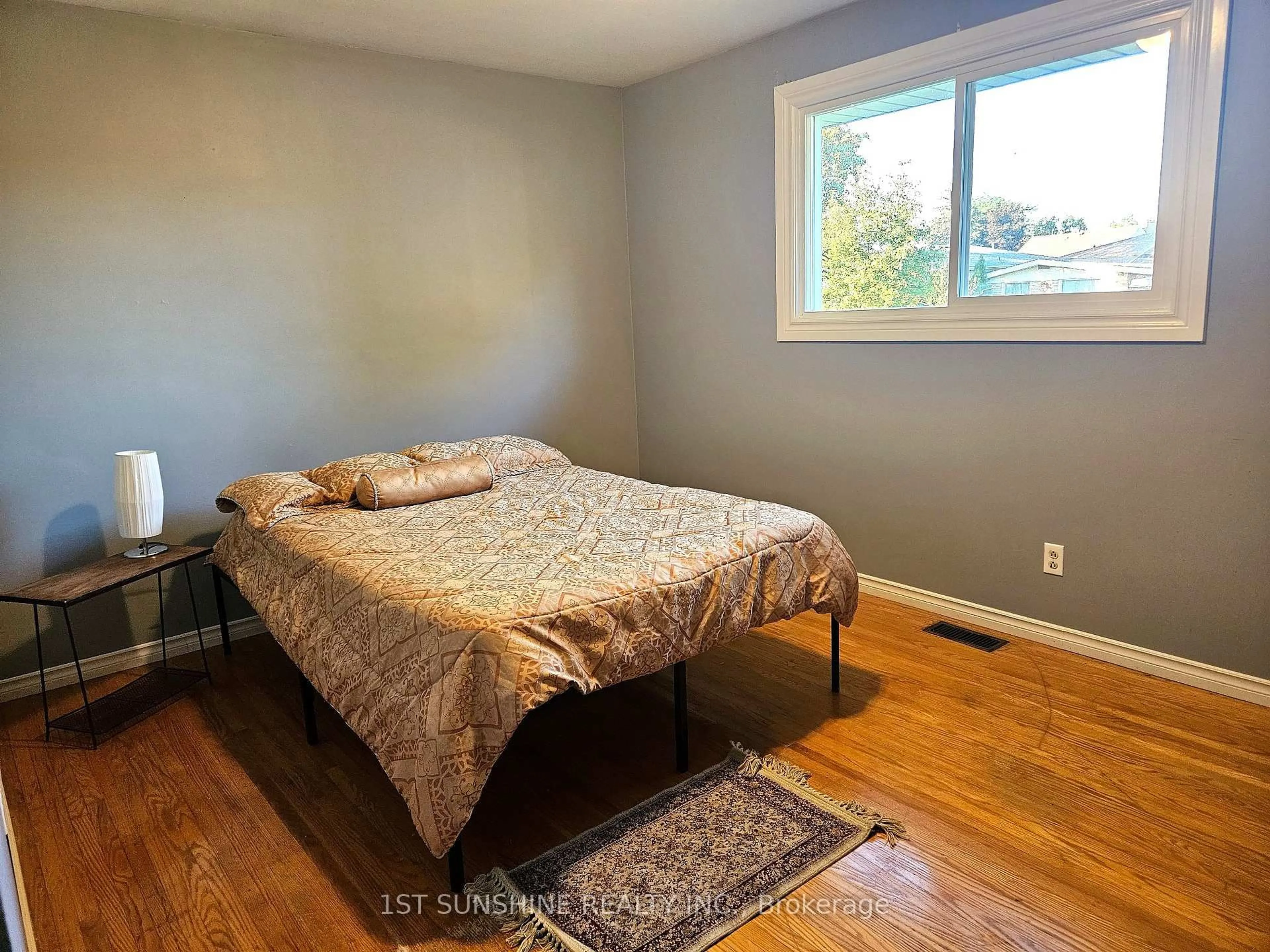 Bedroom with bed, wood/laminate floor for 65 Winding Way, Brantford Ontario N3R 3S4