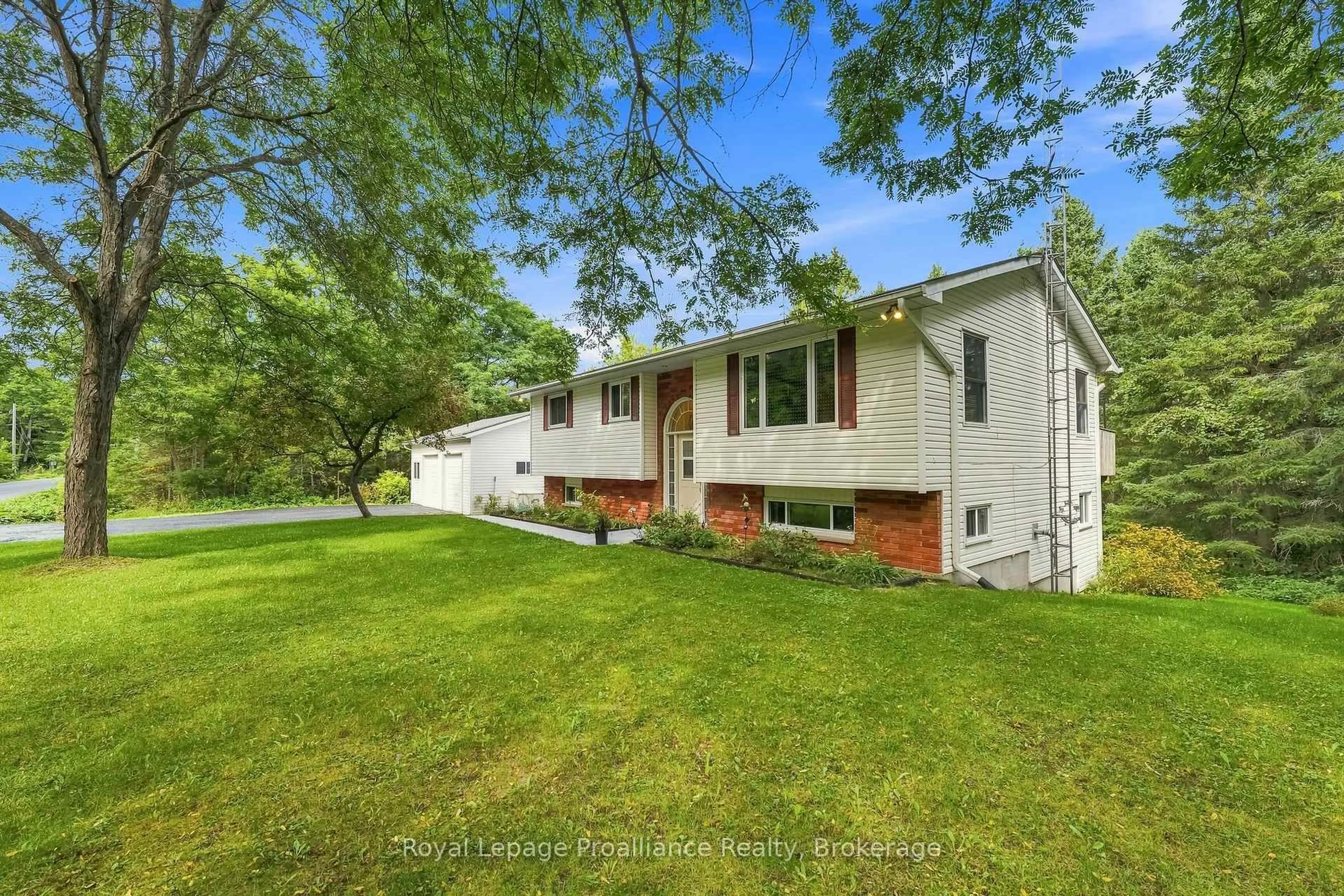 Home with vinyl exterior material, street for 1528 Pinewood School Rd, Brighton Ontario K0K 1R0