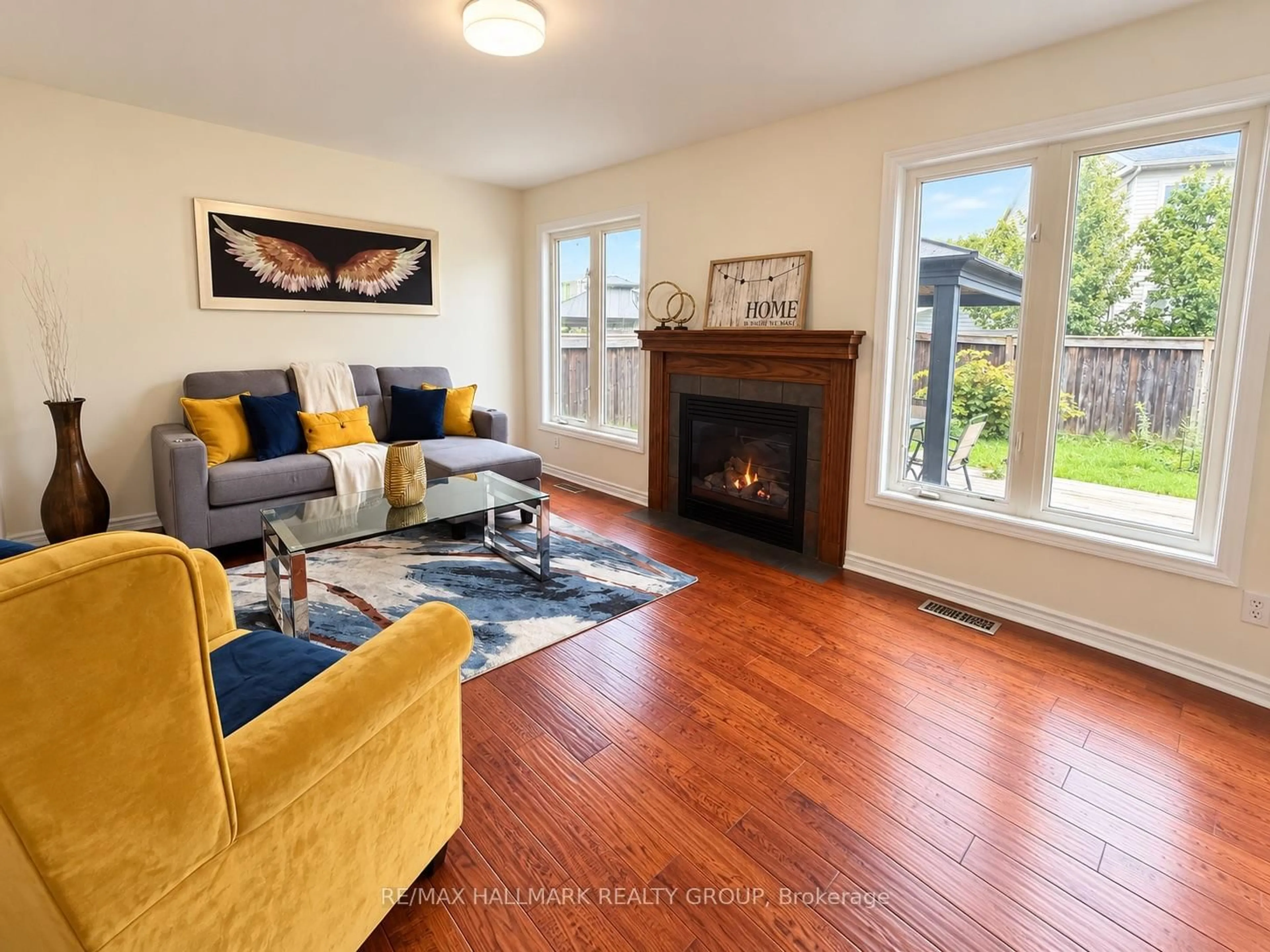 Living room with furniture, wood/laminate floor for 3462 River Run Ave, Ottawa Ontario K2J 0R8