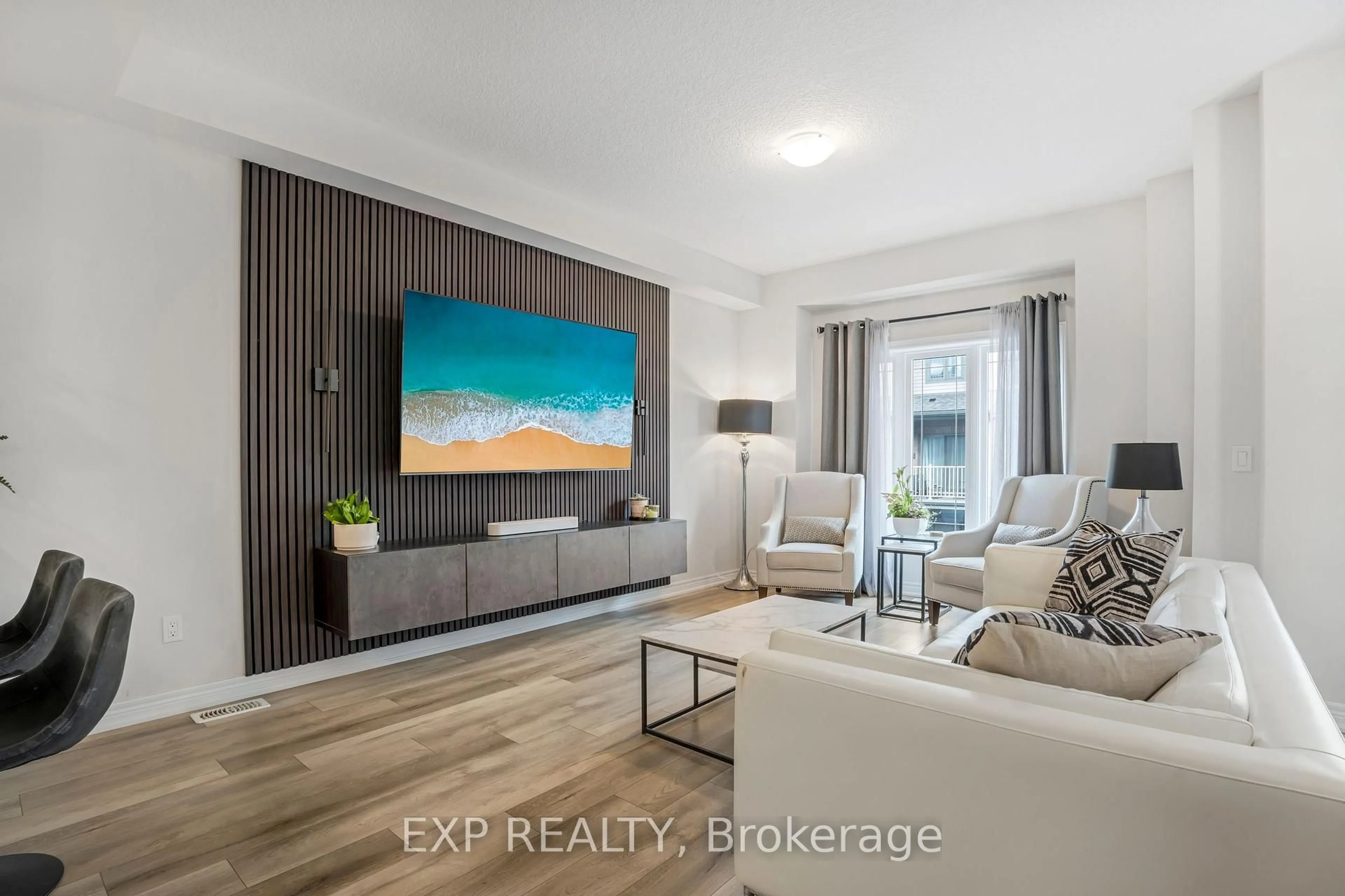 Living room with furniture, wood/laminate floor for 27 Rachel Dr #41, Hamilton Ontario L8E 0K6