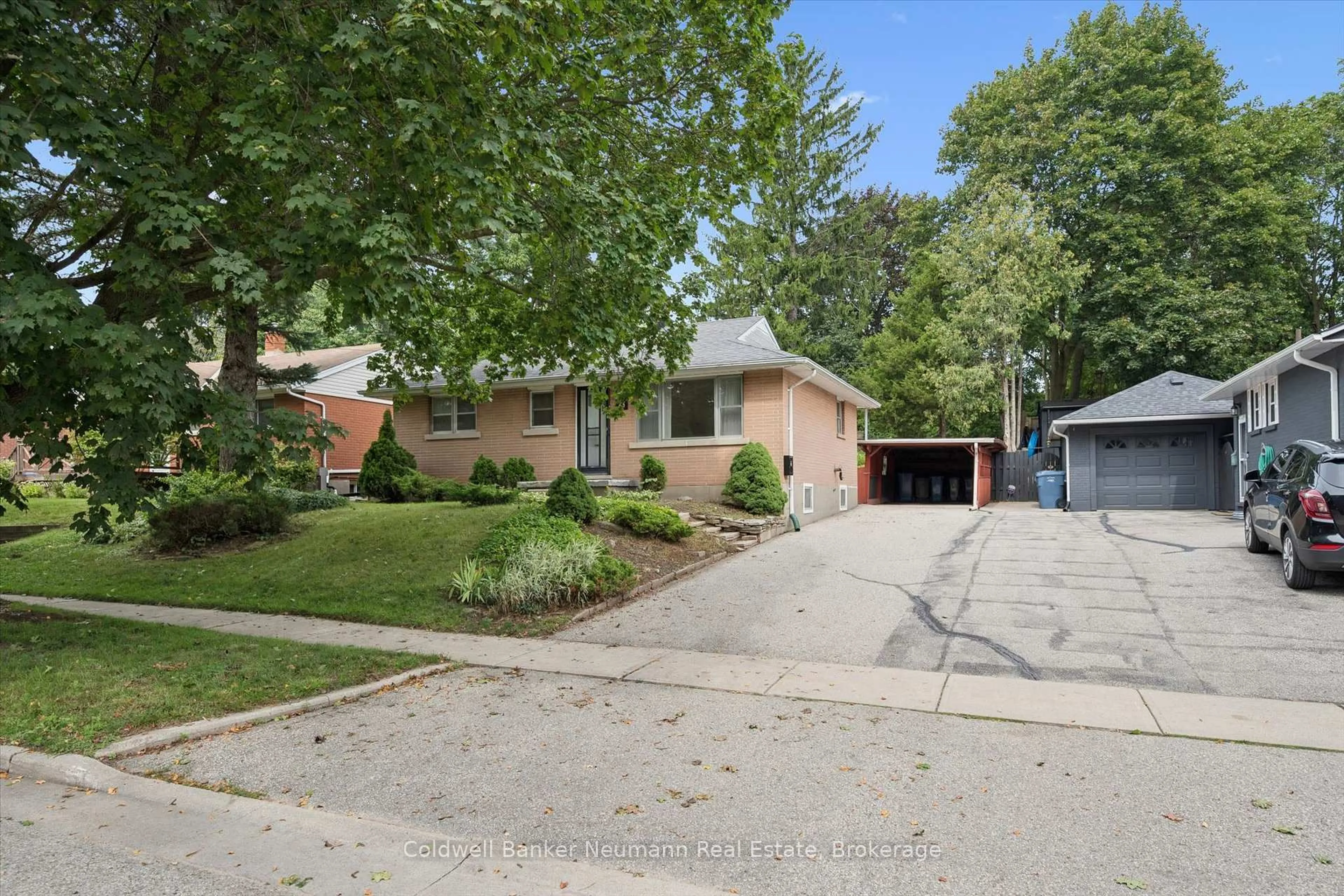 Home with brick exterior material, street for 73 Knightswood Blvd, Guelph Ontario N1E 3W6