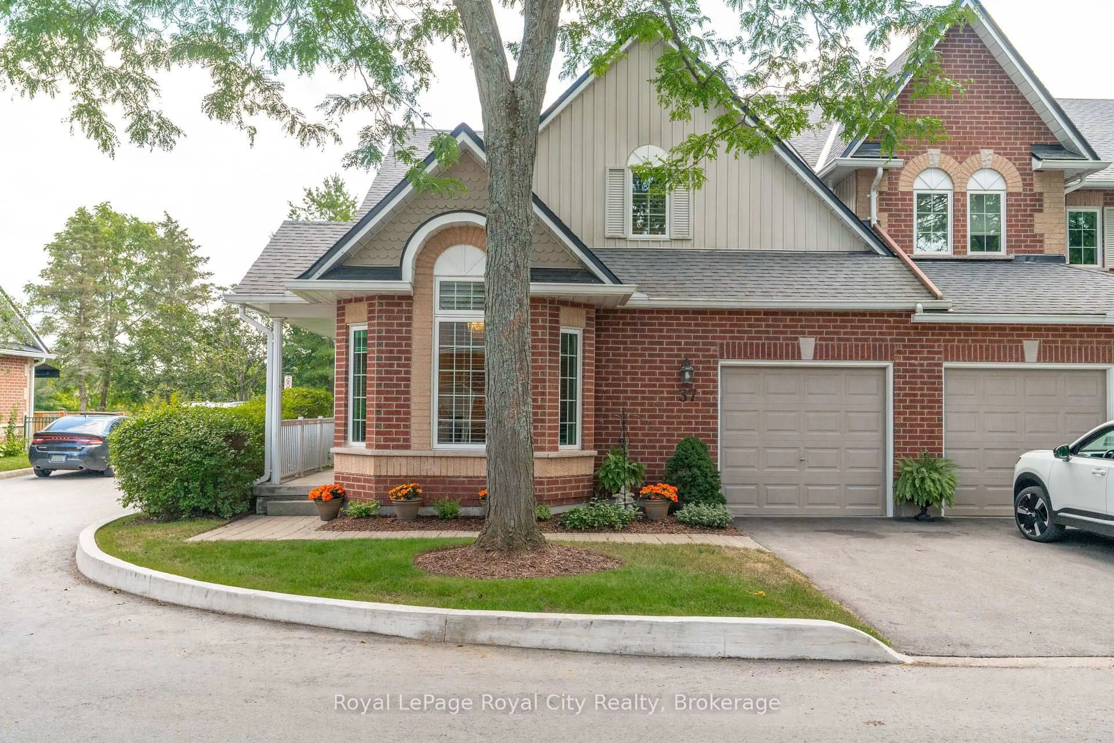 Home with brick exterior material, street for 60 Ptarmigan Dr #37, Guelph Ontario N1C 1E5
