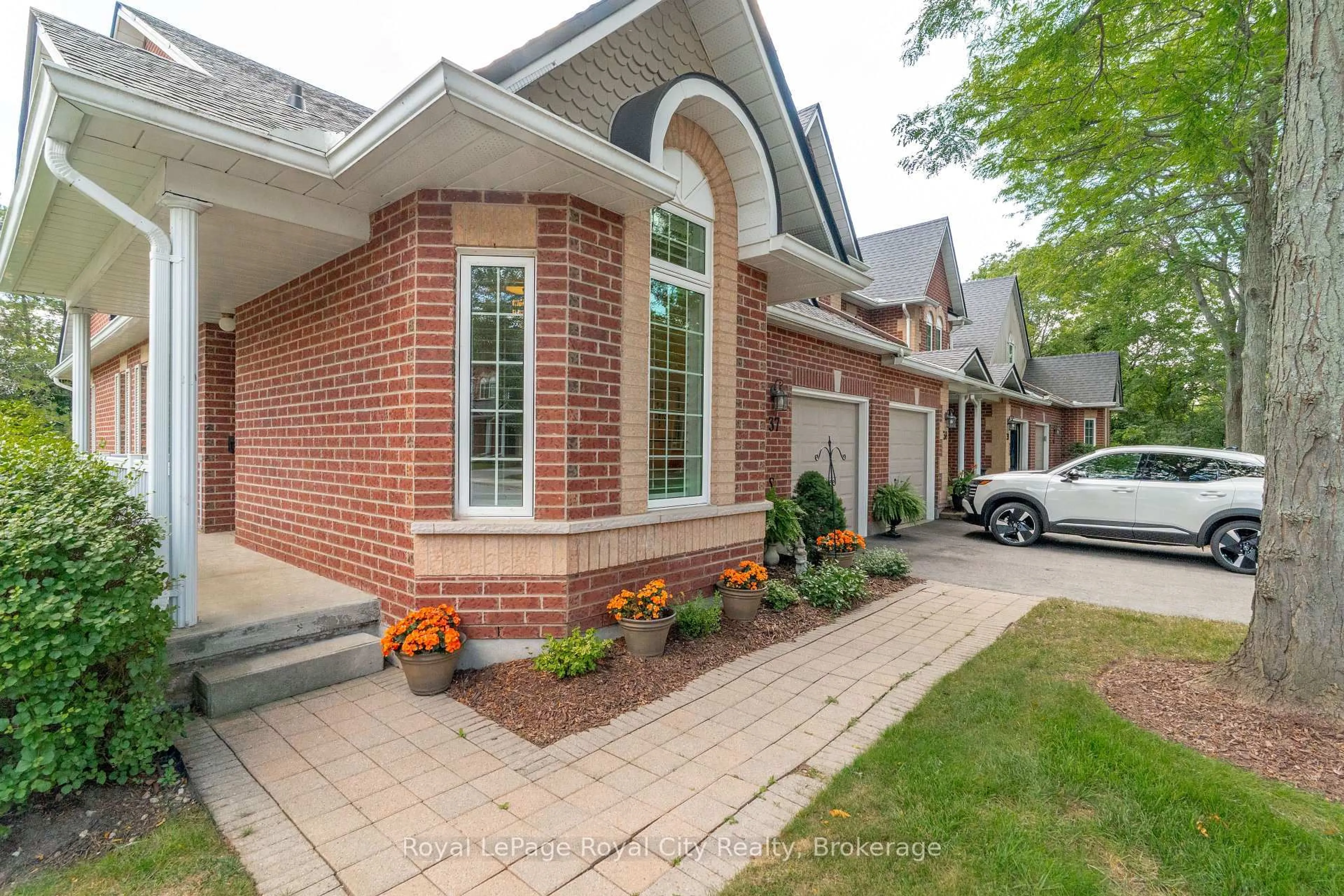Home with brick exterior material, street for 60 Ptarmigan Dr #37, Guelph Ontario N1C 1E5