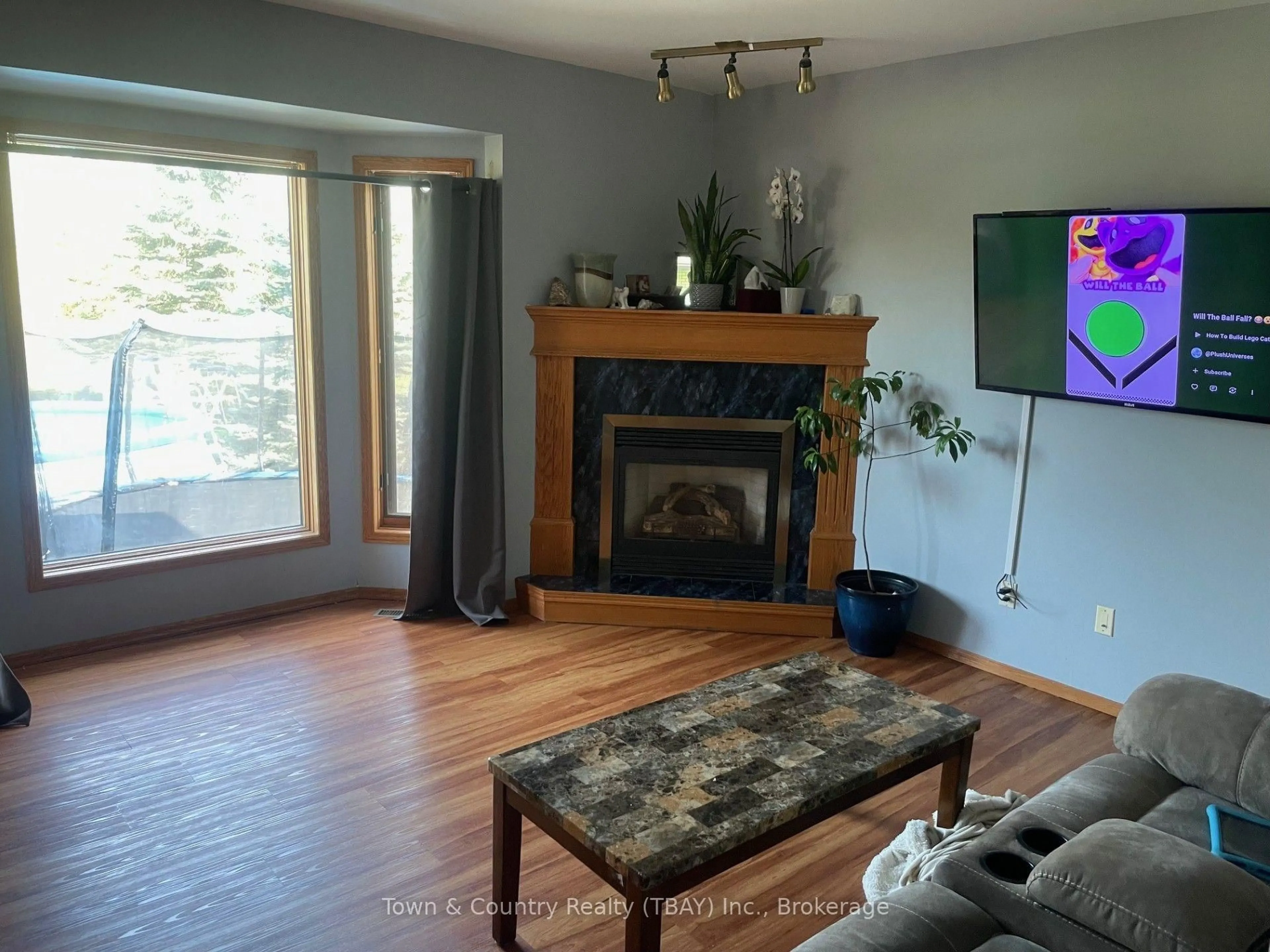 Living room with furniture, wood/laminate floor for 1244 Dawson Rd, Thunder Bay Ontario P7G 1H7