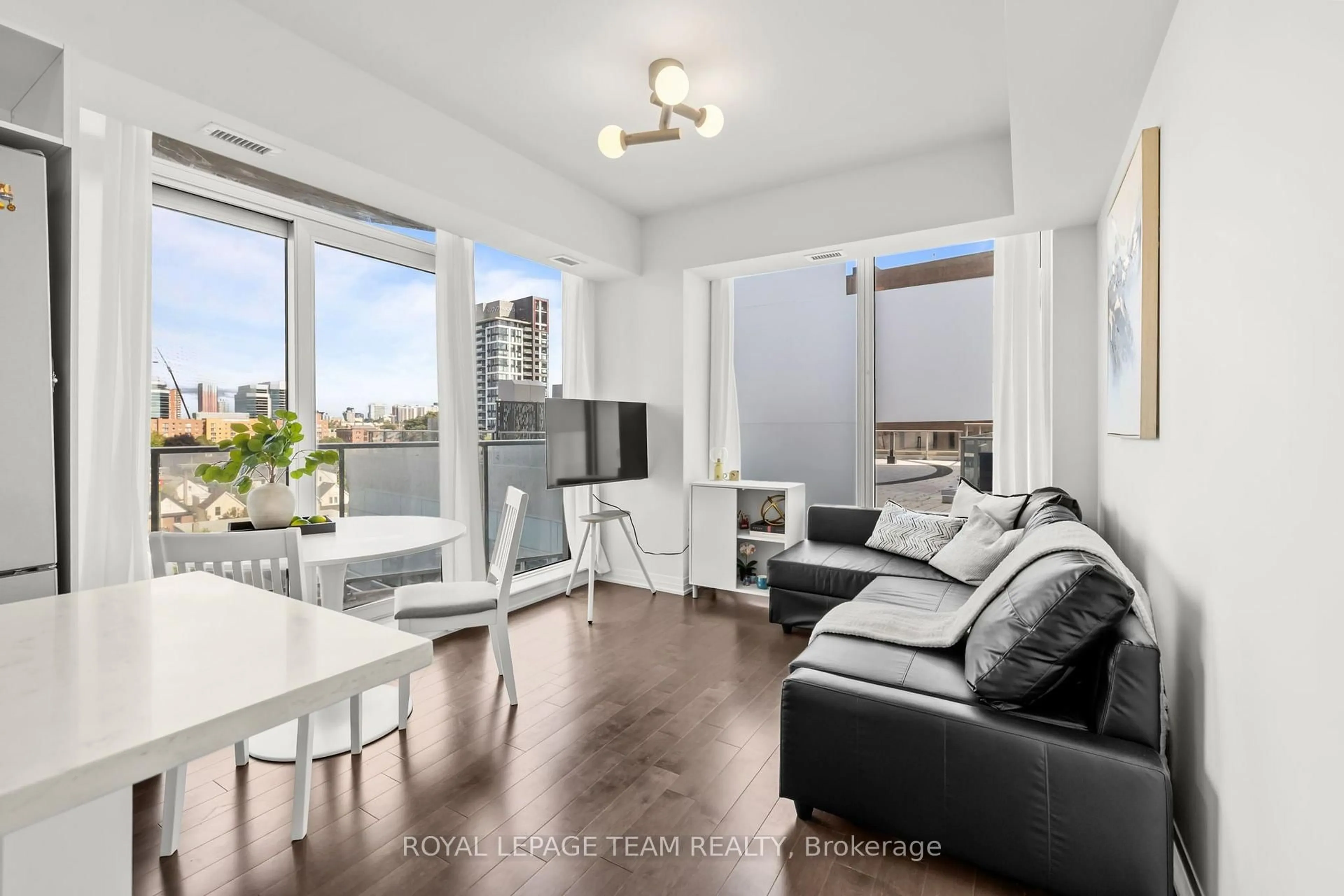 Living room with furniture, unknown for 805 Carling Ave #501, Ottawa Ontario K1S 5W9